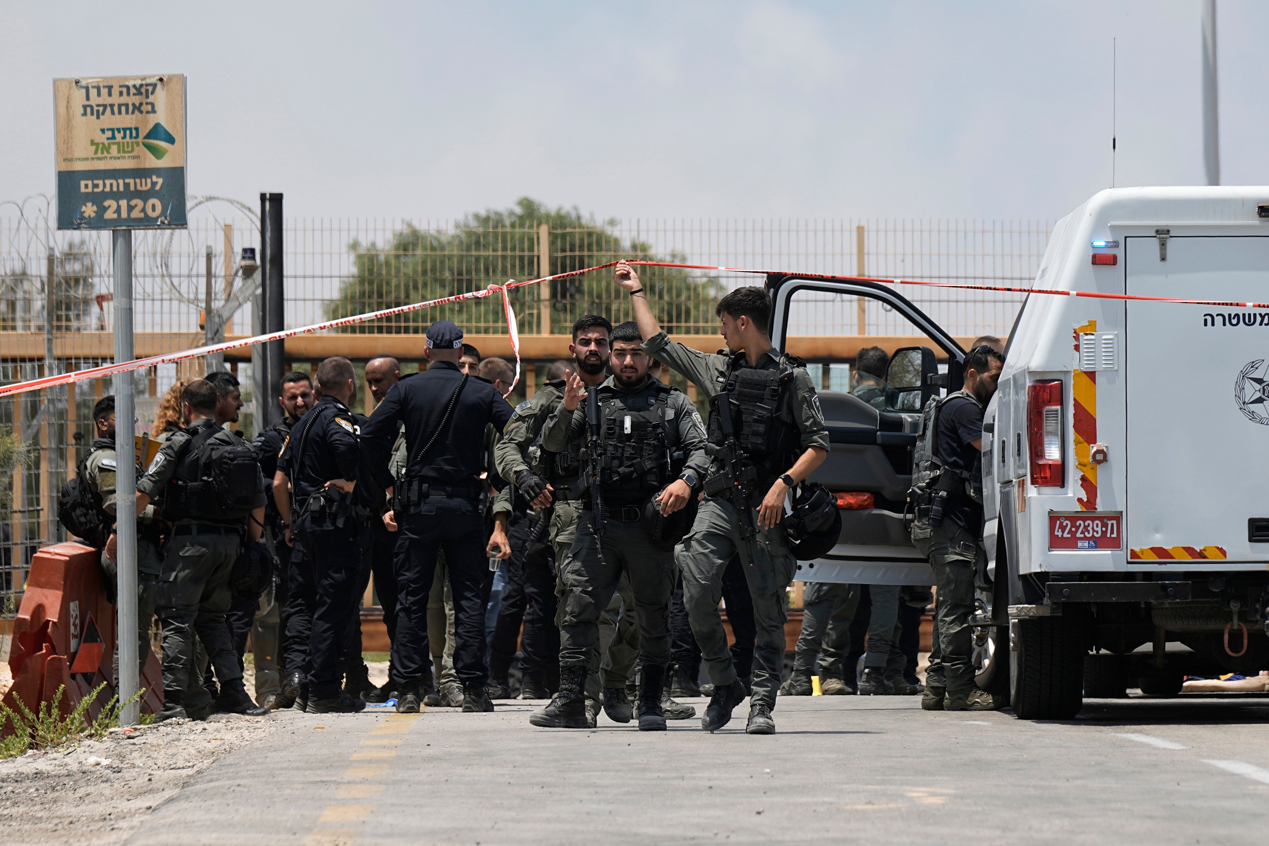 Israeli Police investigate an attempted stabbing attack at the entrance to Netiv Haasara, north of the Gaza border in southern Israel on Monday. Photo: AP 
