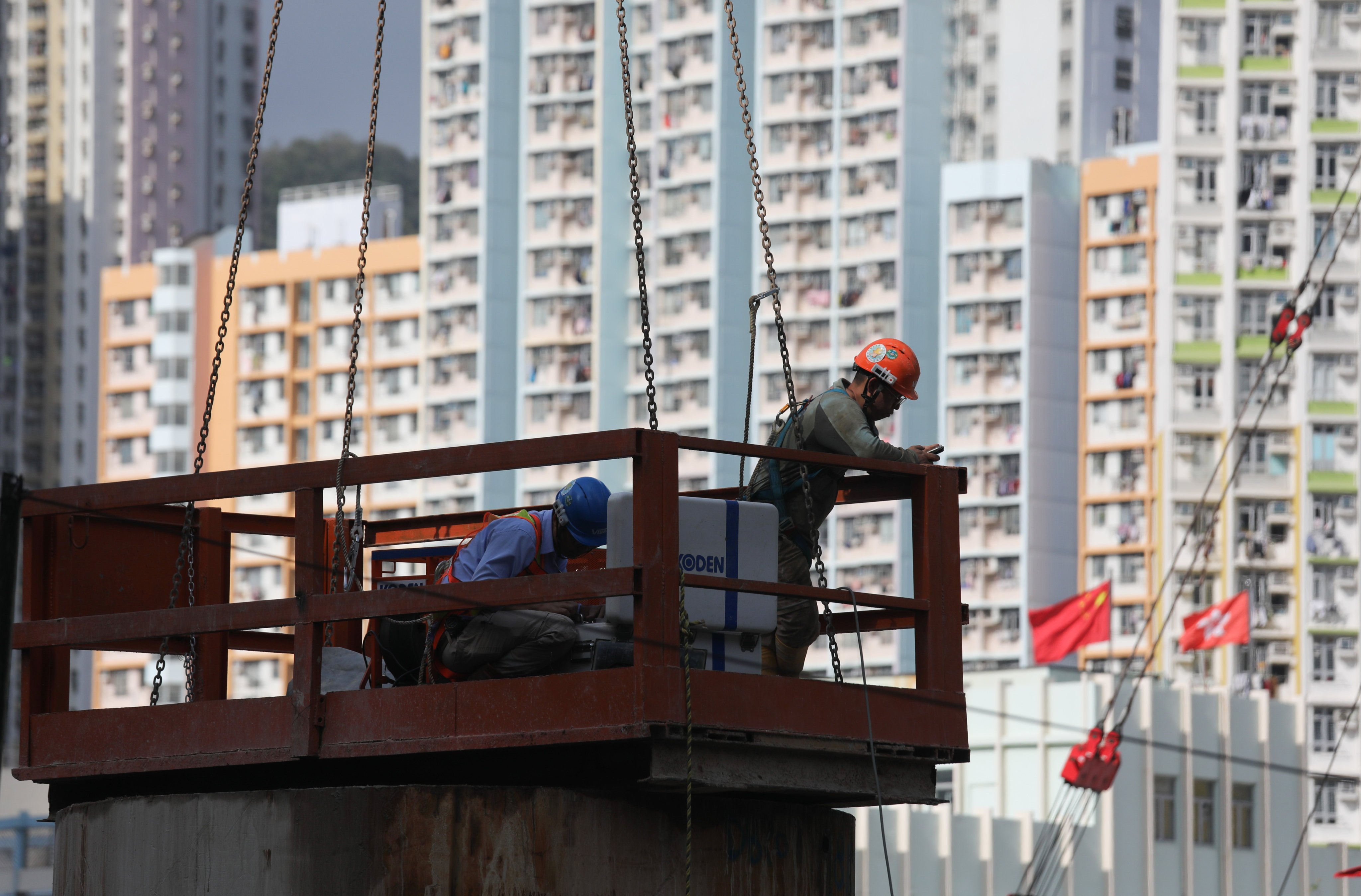 Workers at a public housing construction site in Cheung Sha Wan. Photo: Xiaomei Chen