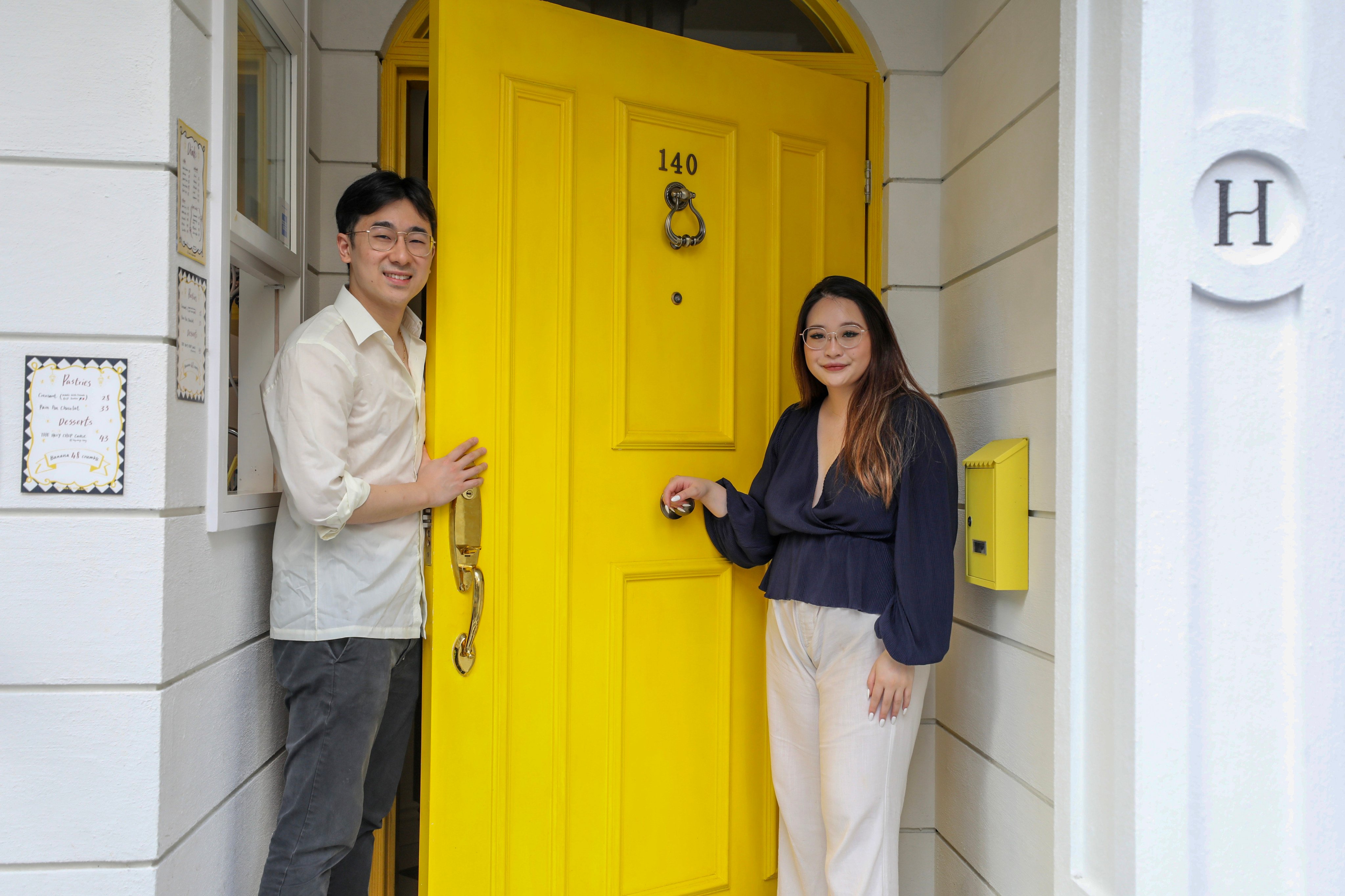 The Holywell’s founders Andrea Mak and Richard Tam at the door to their bar. Photo: Xiaomei Chen