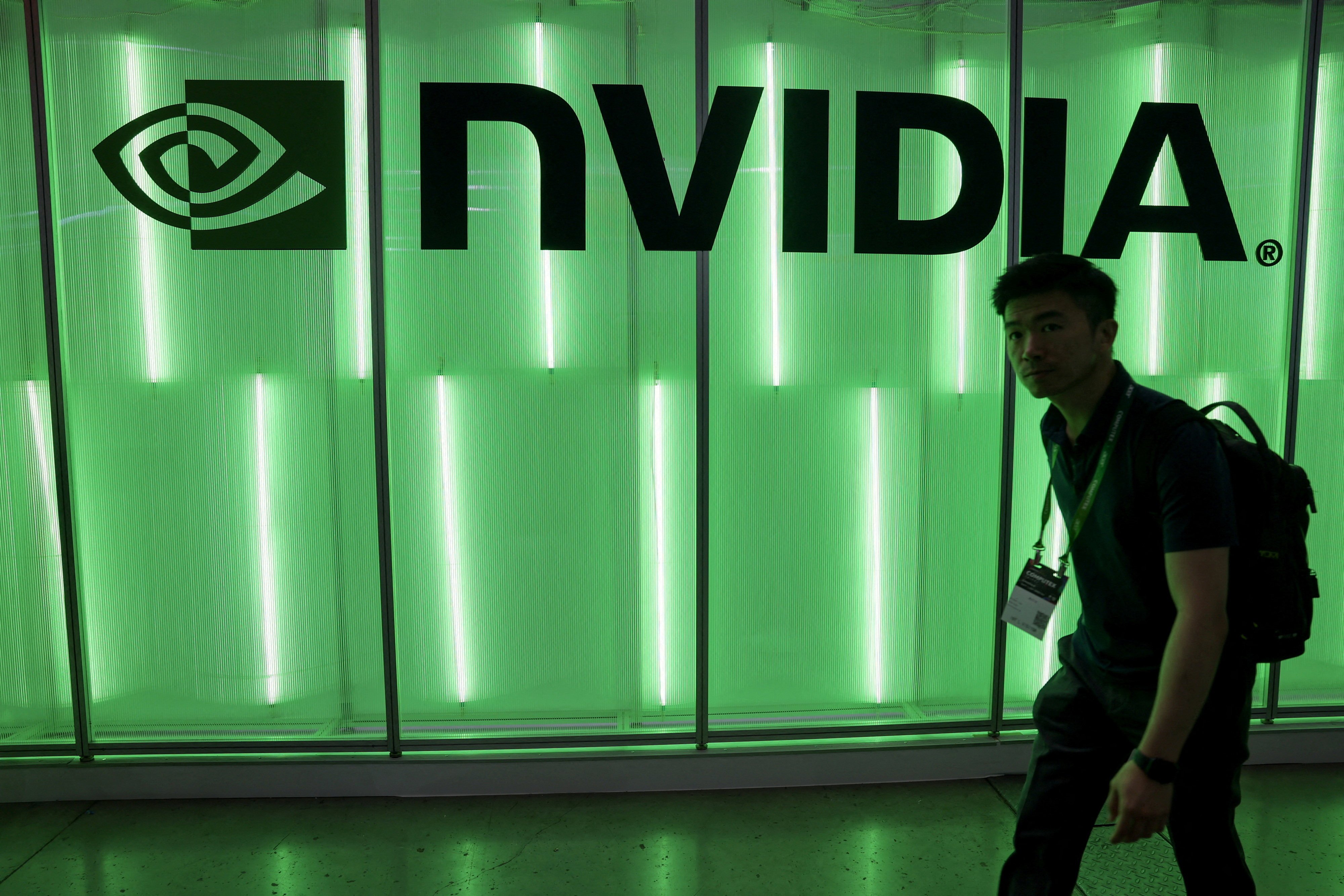 An attendee walks past an Nvidia logo at Computex in Taipei, Taiwan, June 5, 2024. Photo: Reuters