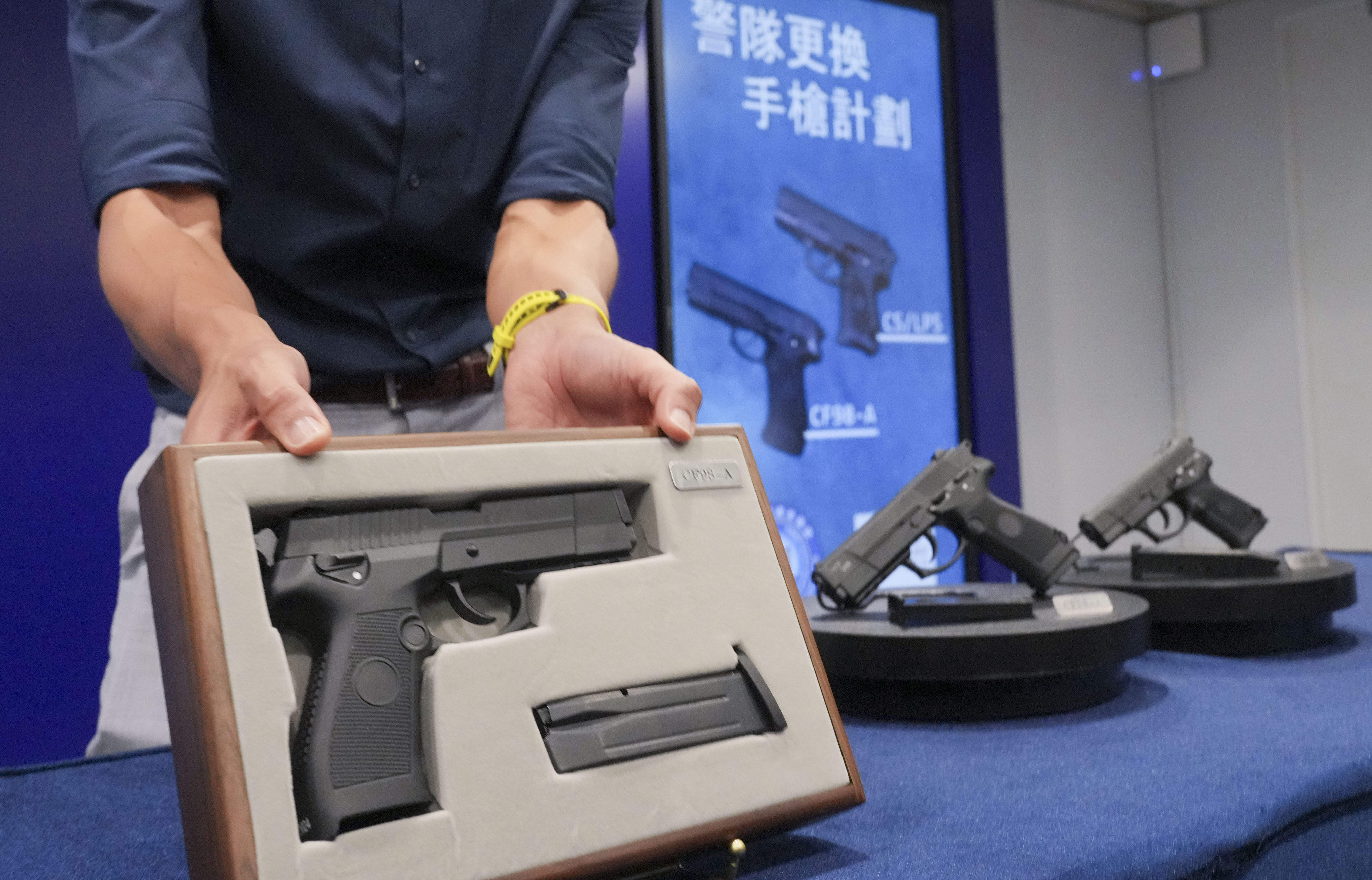 The 9mm CF98-A pistols (left) with a 15-round capacity are displayed at a press conference at police headquarters in Wan Chai. Photo: May Tse