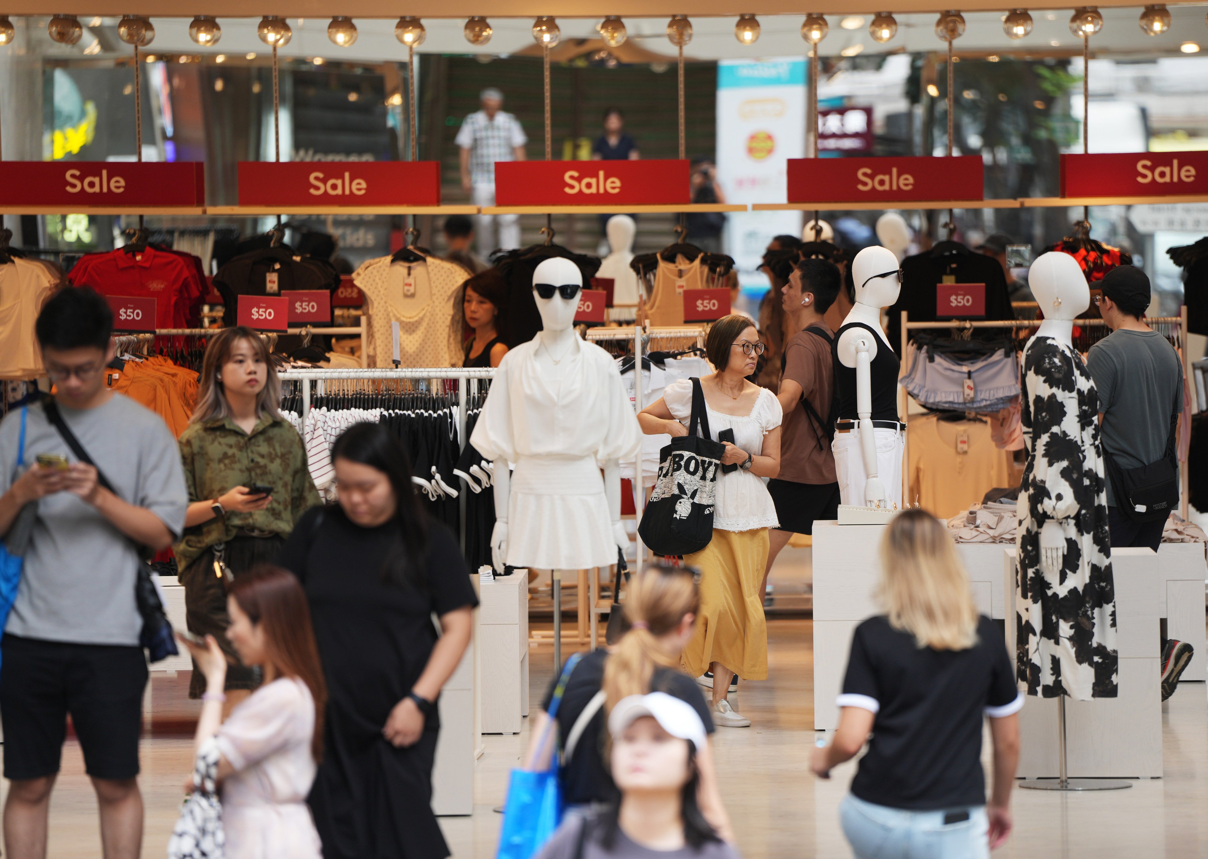 Consumers shop in Causeway Bay. The finance chief has noted e-shopping accounted for only 8 per cent of retail sales in Hong Kong last year, compared with the mainland’s 28 per cent. Photo: Sam Tsang