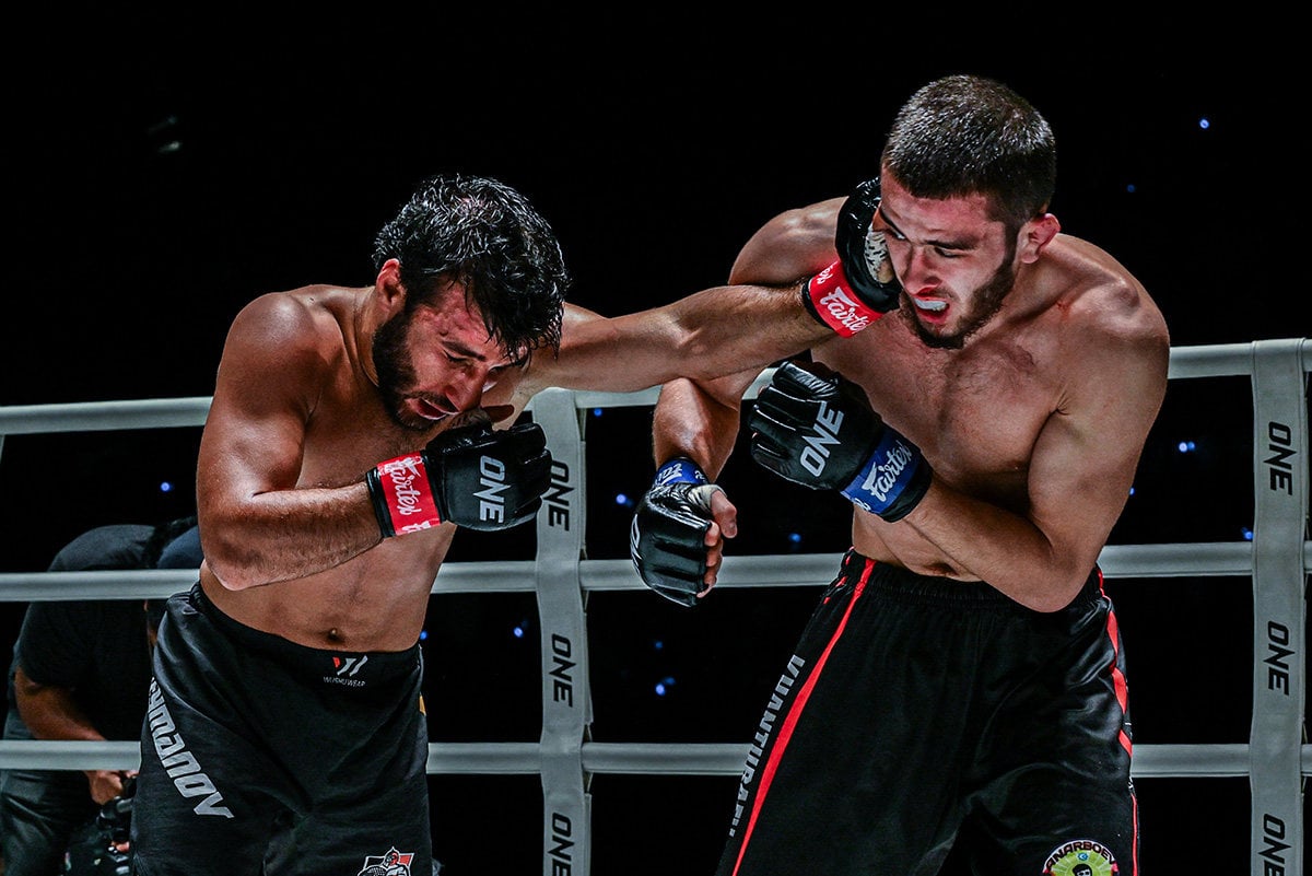 Sanzhar Zakirov (right) takes a punch during his victory over Zayundin Suleymanov. Photo: ONE Championship
