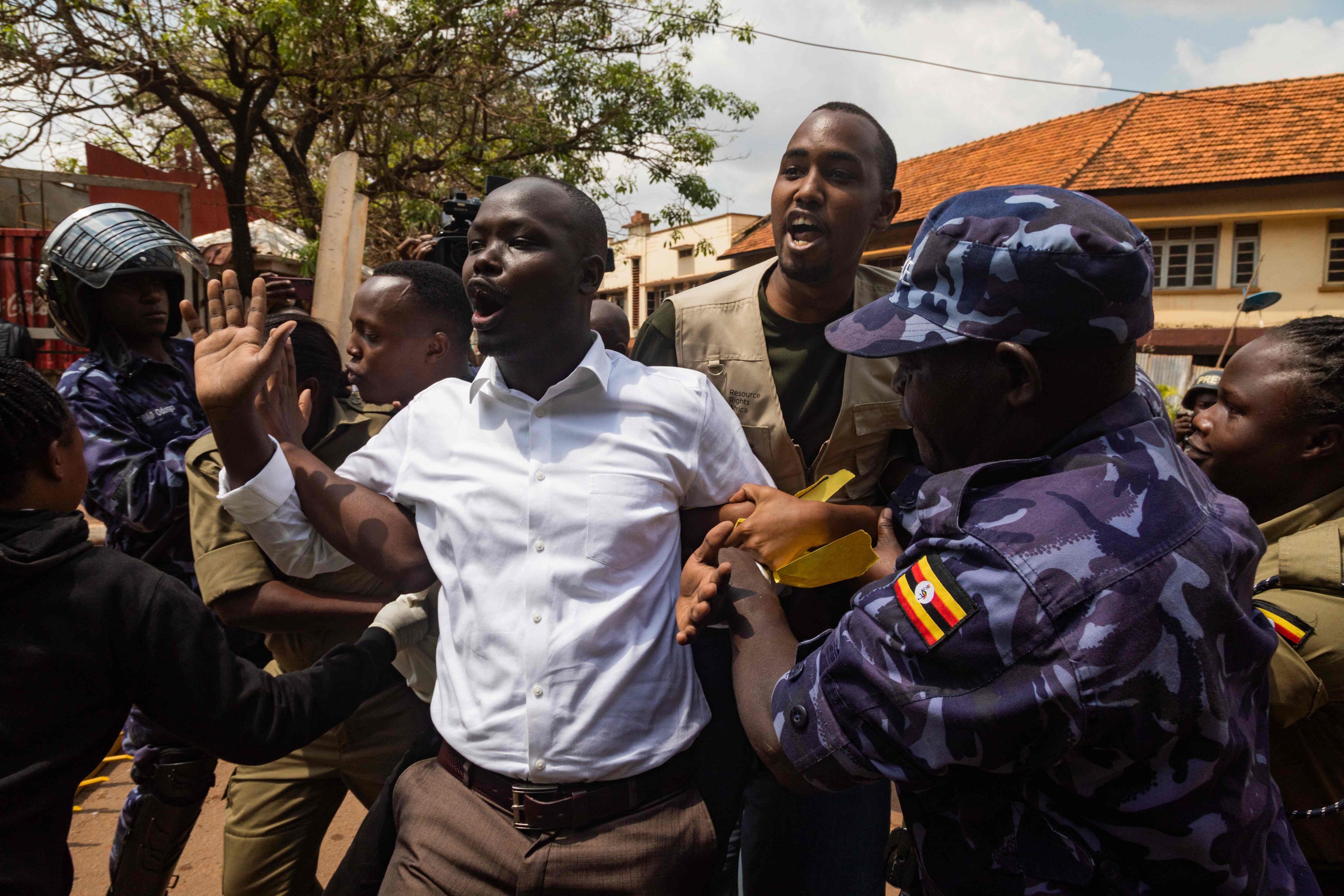 Ugandan Police arrest protesters marching on parliament during a planned anti-corruption demonstration in Kampala. July 23. Photo: AFP