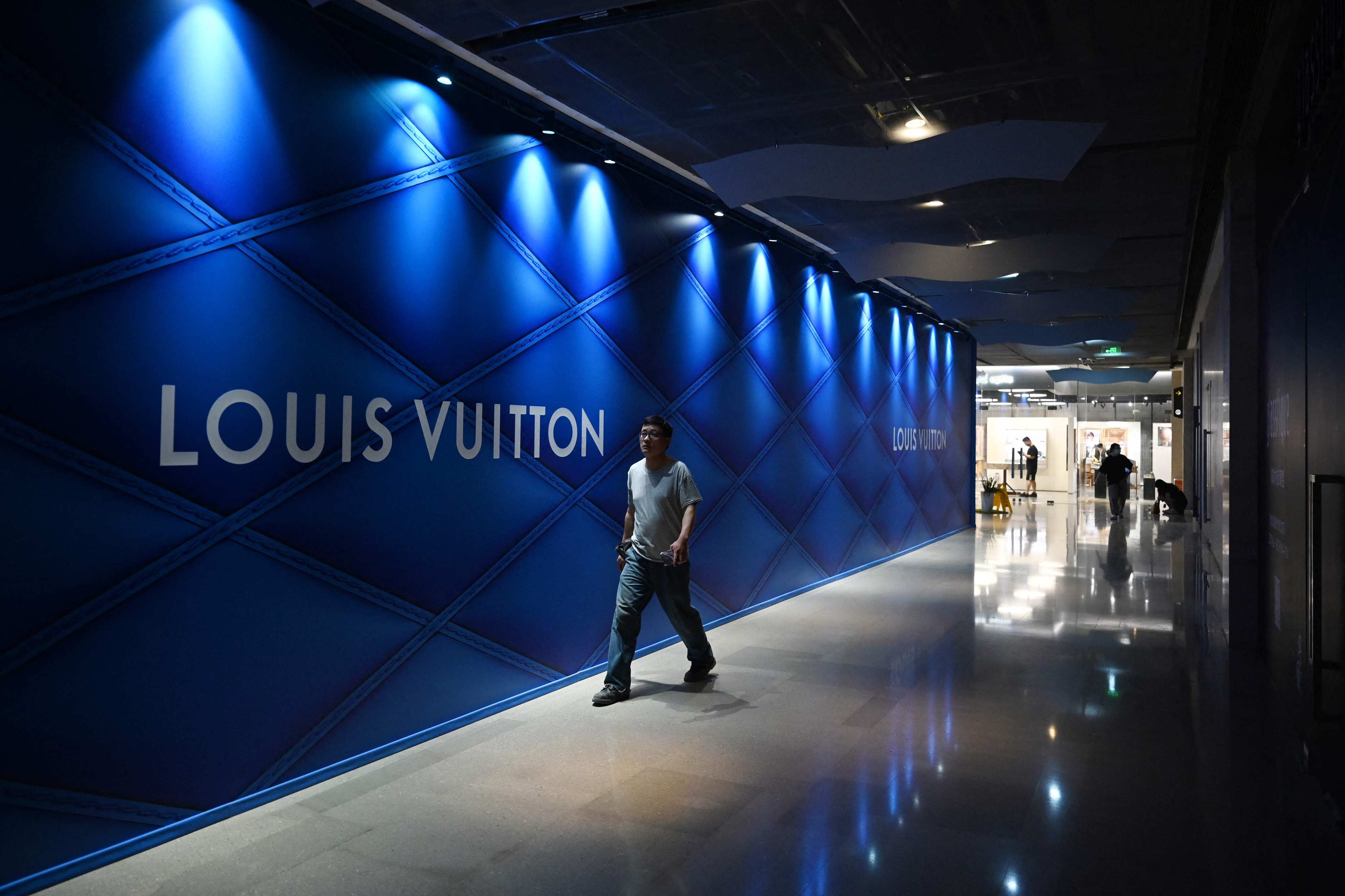 A man walks past an under-construction Louis Vuitton store at a shopping mall in Beijing on July 14, 2024. Photo: AFP