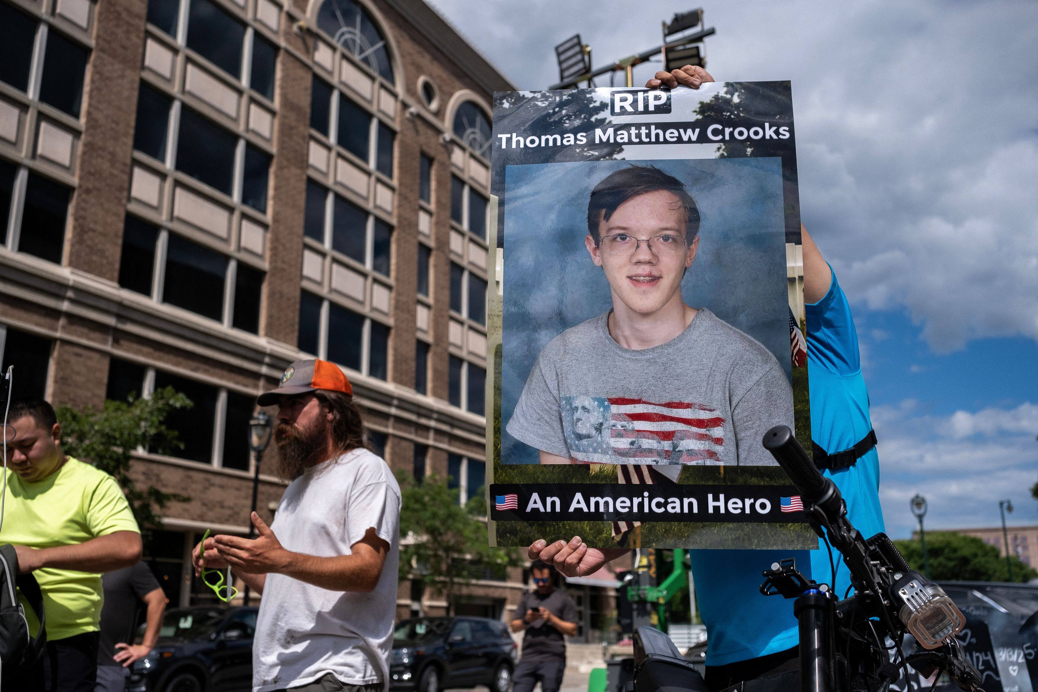 A demonstrator holds a sign with a photo of Thomas Matthew Crooks in Milwaukee, Wisconsin, on July 17. Photo: AFP