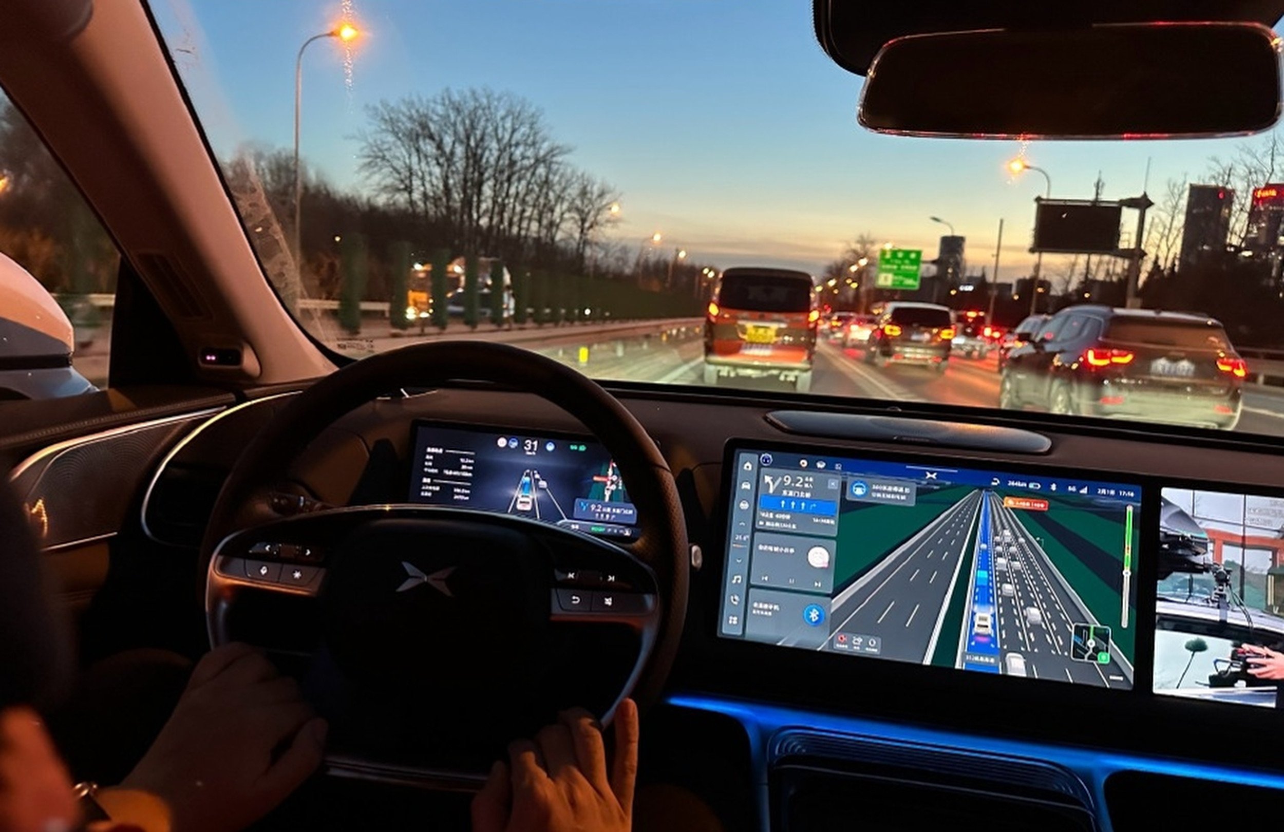 Drivers using Xpeng’s self-driving software are required by law to place their hands on the steering wheel to override the system during emergencies. Photo: Weibo