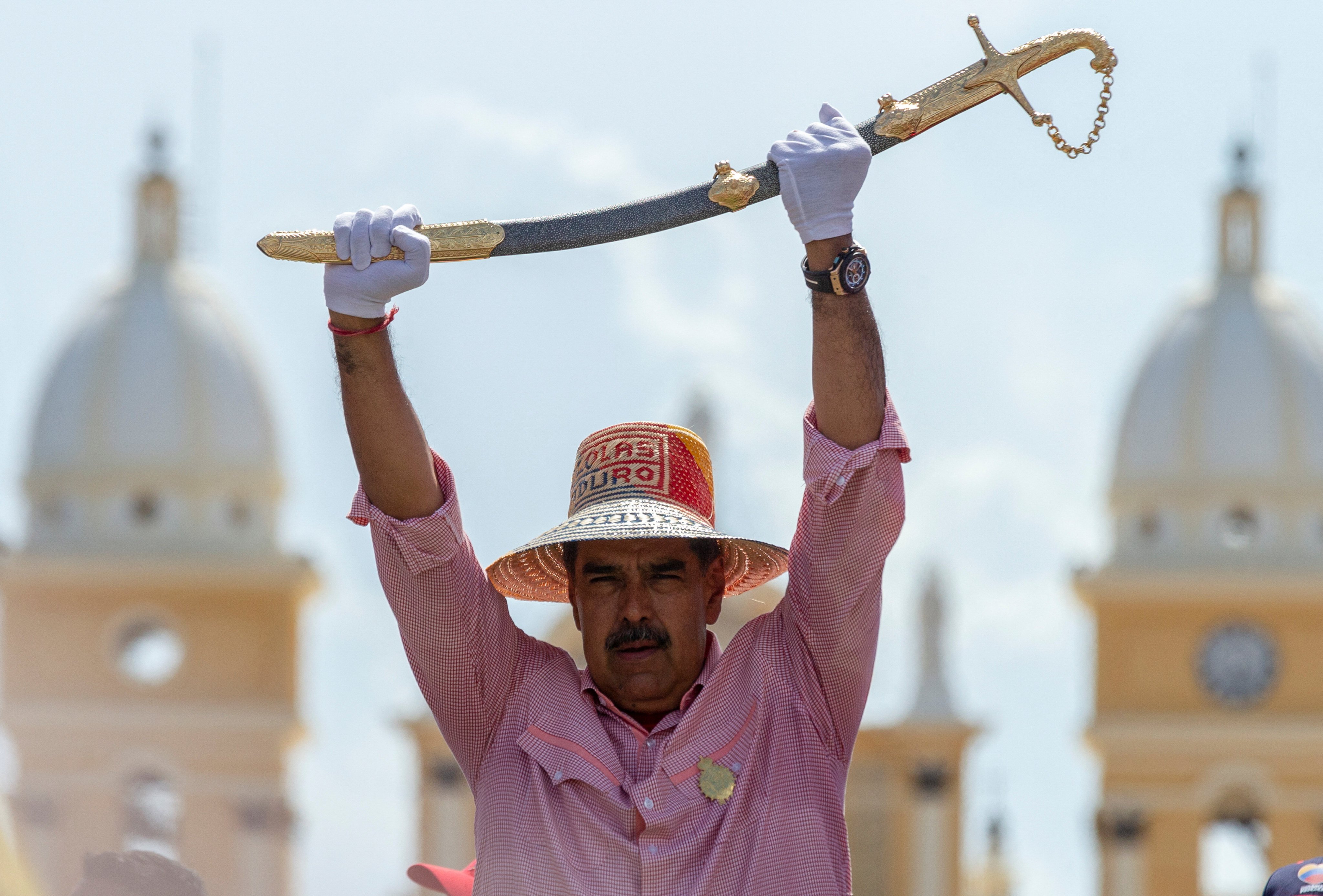 Venezuela’s President Nicolas Maduro holds the sword of independence hero Simon Bolivar during a campaign rally. Photo: Reuters