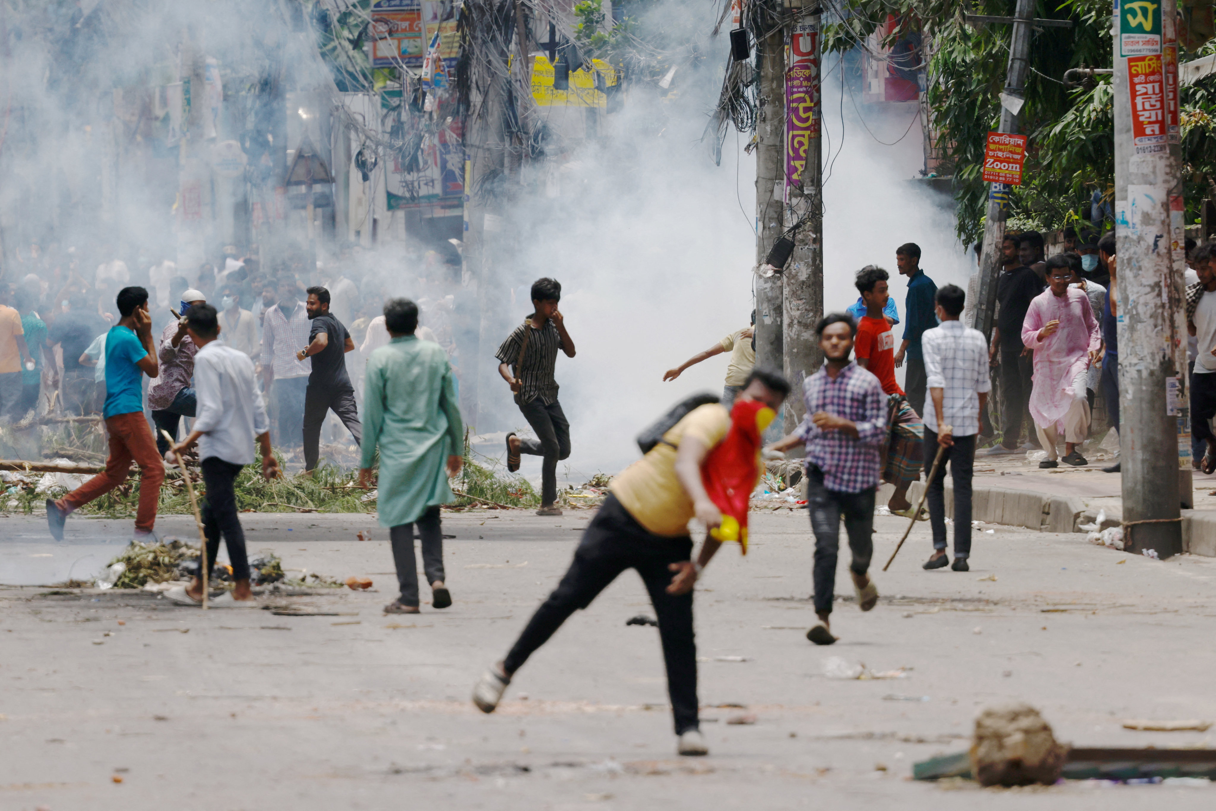 Protesters clash with Border Guard Bangladesh and the police outside the state-owned Bangladesh Television as violence erupts across the country after anti-quota protests by students, in Dhaka. Photo: Reuters