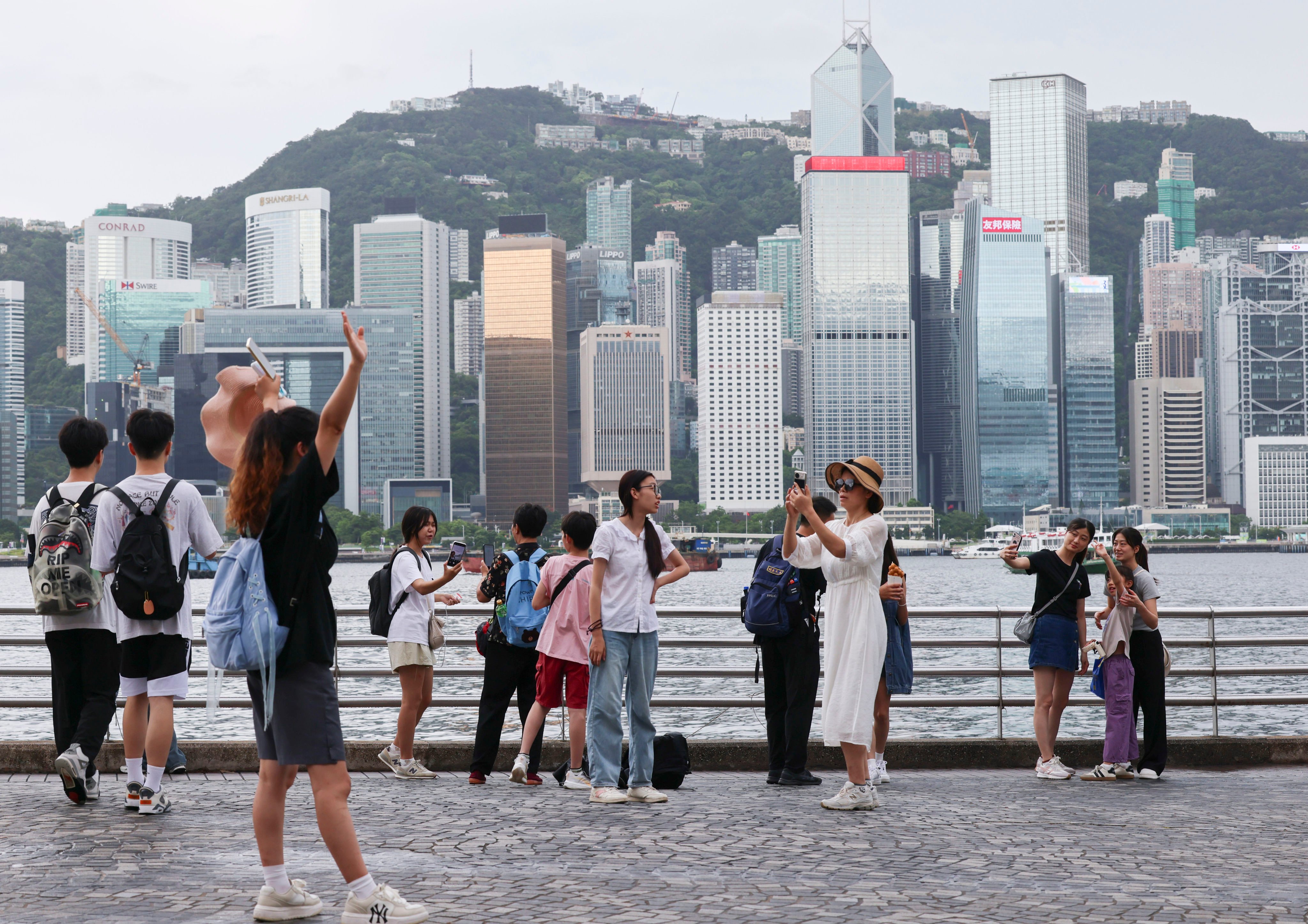 Tourists visit the Tsim Sha Tsui waterfront. Hong Kong has come in 13th place on a list ranking the world’s safest cities. Photo: Jelly Tse