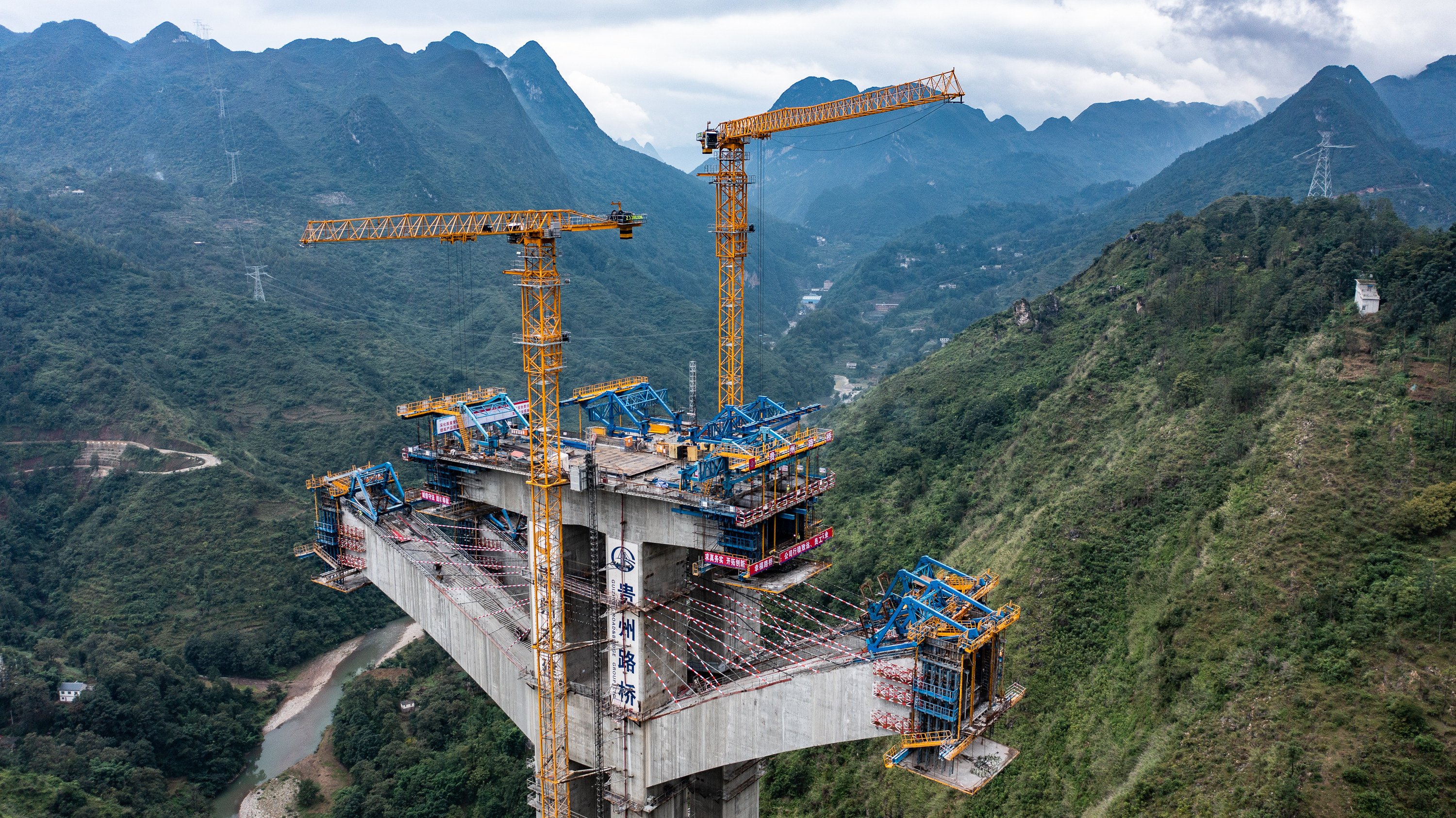 Sprawling bridges, like this one being built in China’s Guizhou province, can raise debt levels among local governments. Photo: Xinhua