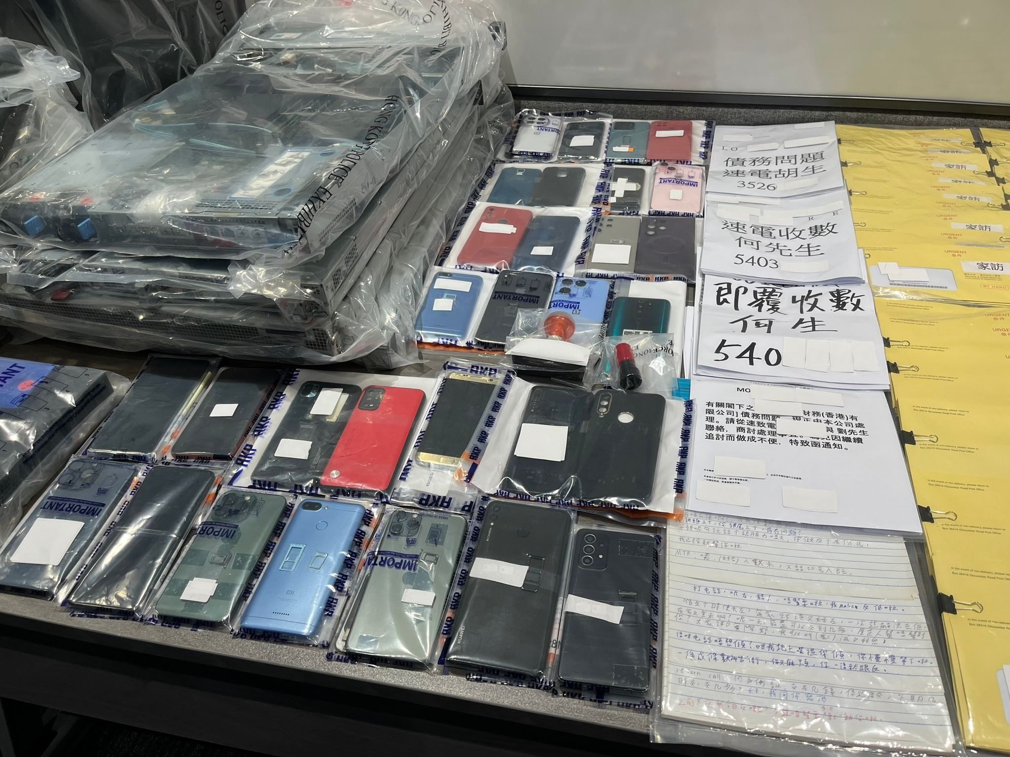 Hong Kong police found the personal information of a few thousand debtors in the loan shark syndicate’s office. Photo: Handout