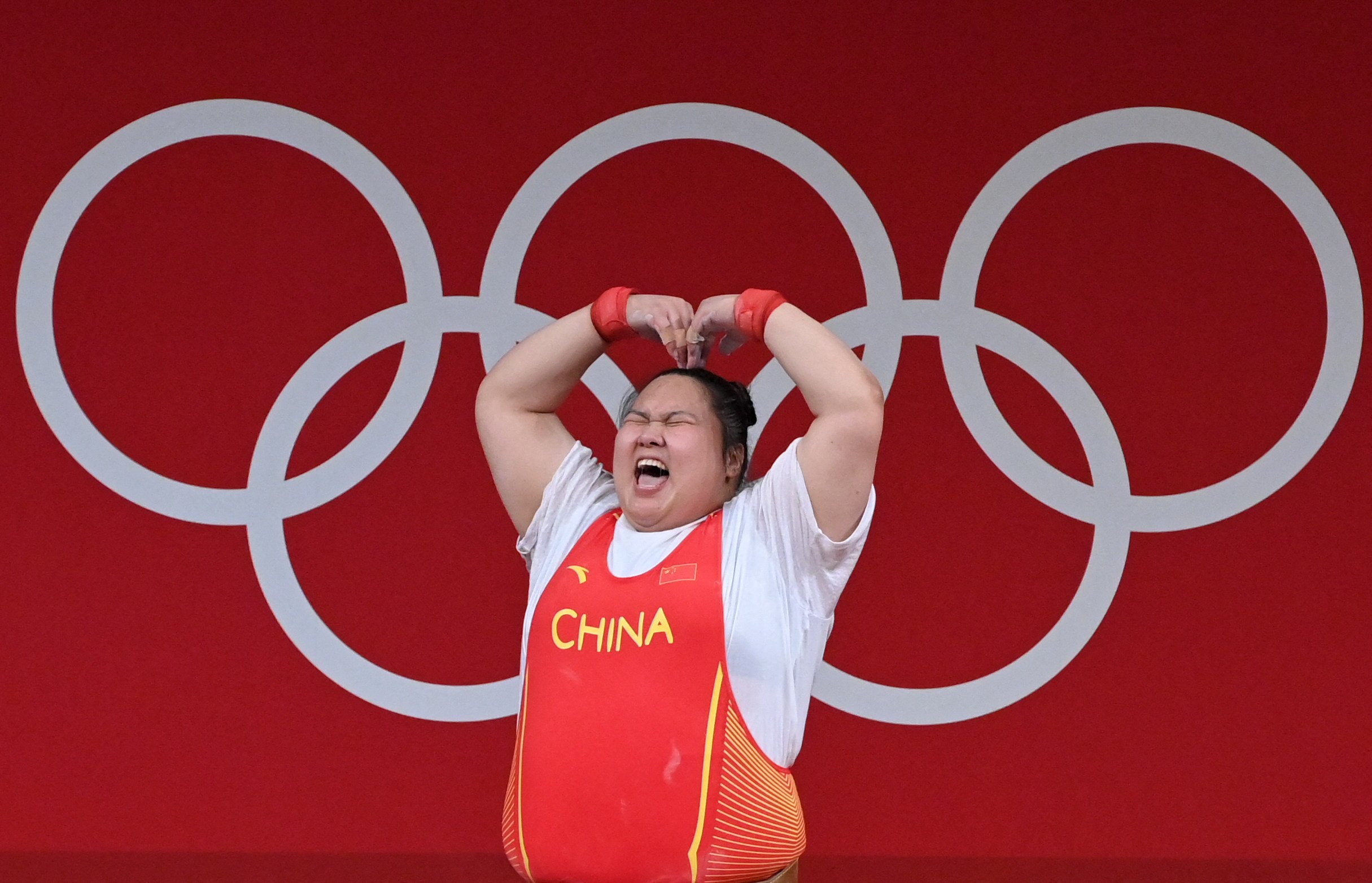 China’s Li Wenwen celebrates in the women’s +87kg weightlifting competition during the Tokyo 2020 Olympic Games. Researchers warn that heat conditions in Paris this summer could be worse than they were during the last Games. Photo: AFP