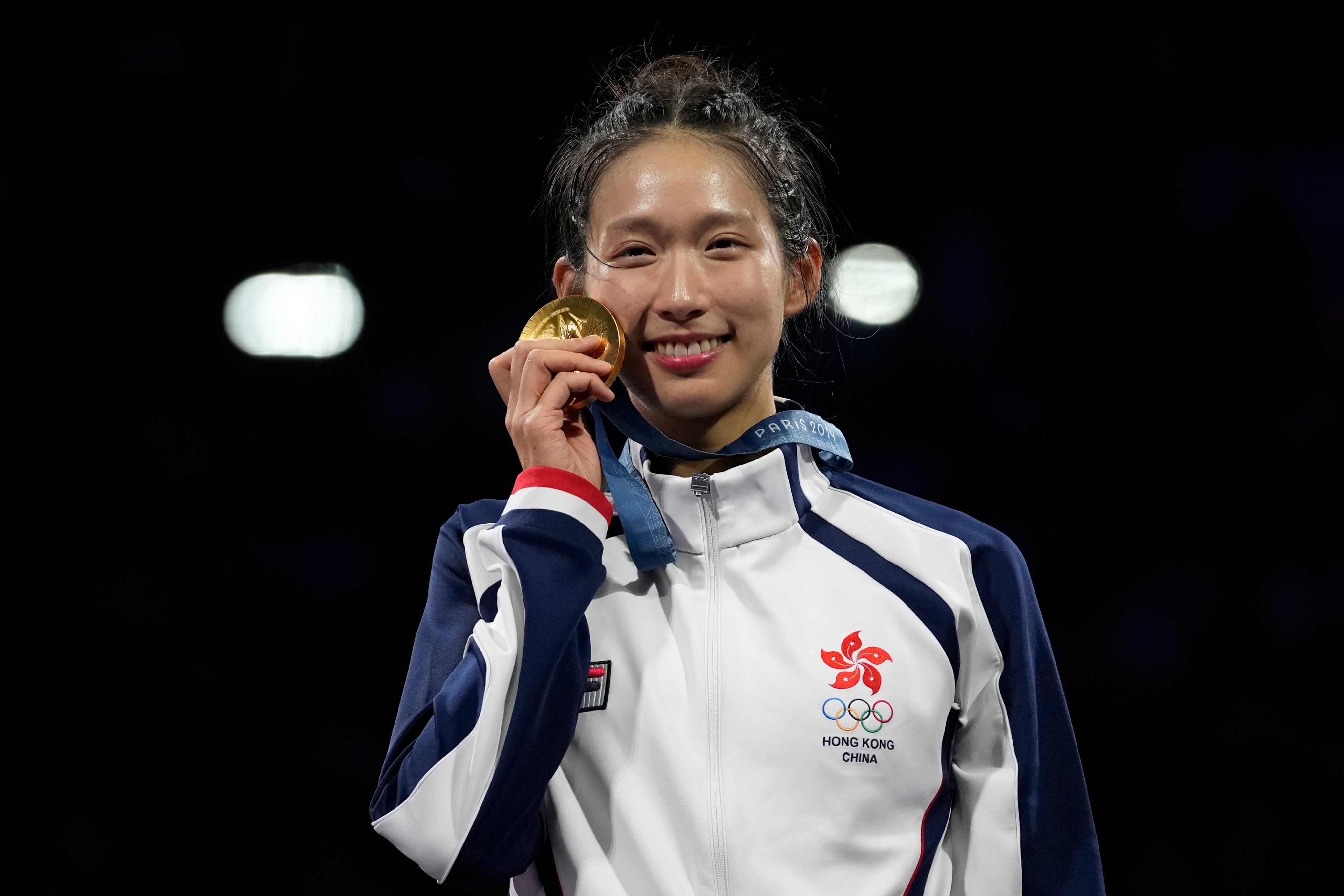 Hong Kong’s Vivian Kong with her gold medal in the women’s individual epee. Photo: AP