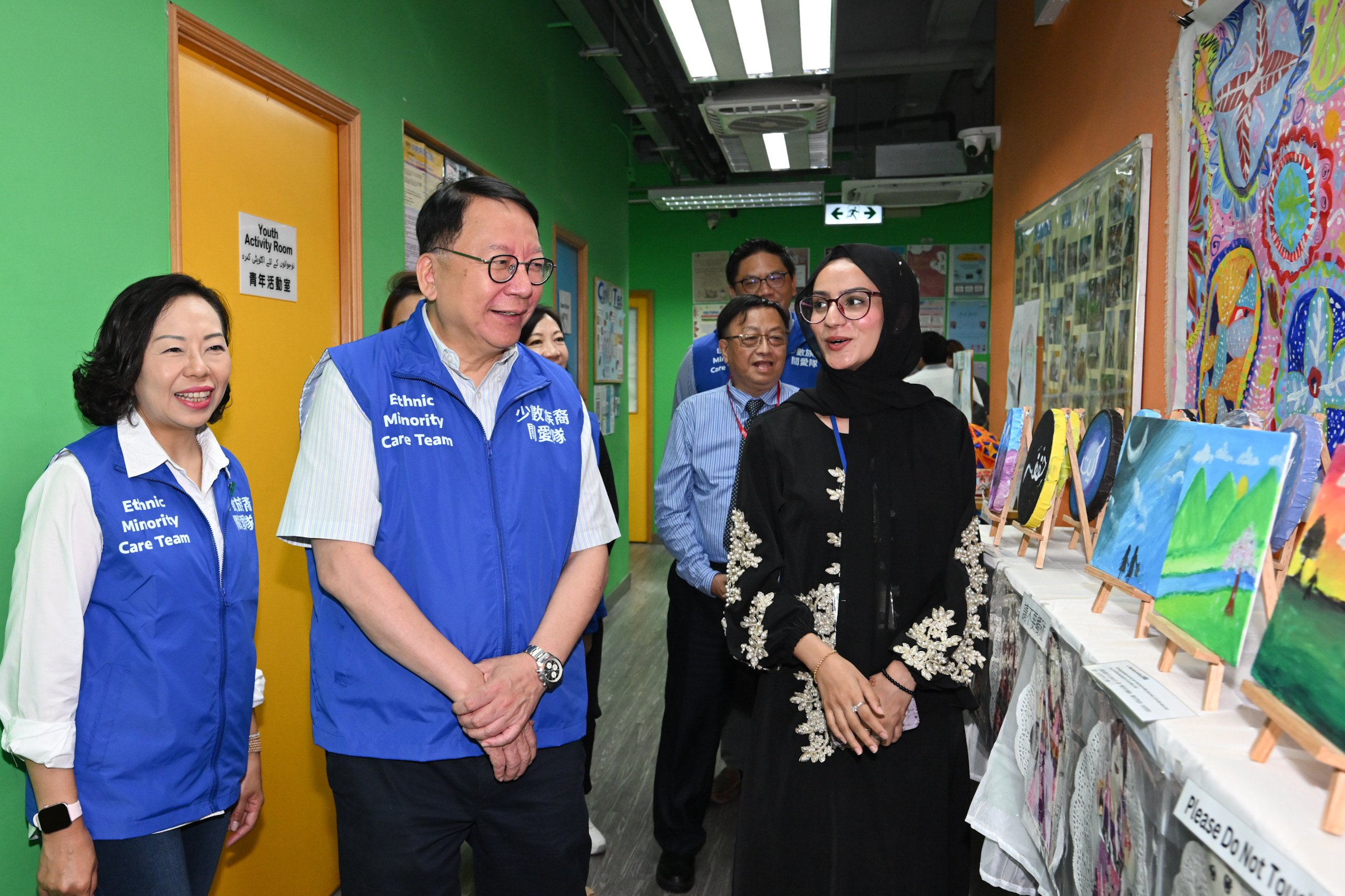 Chief Secretary Eric Chan (second from left) visits one of the service centres for ethnic minority groups. Photo: Handout