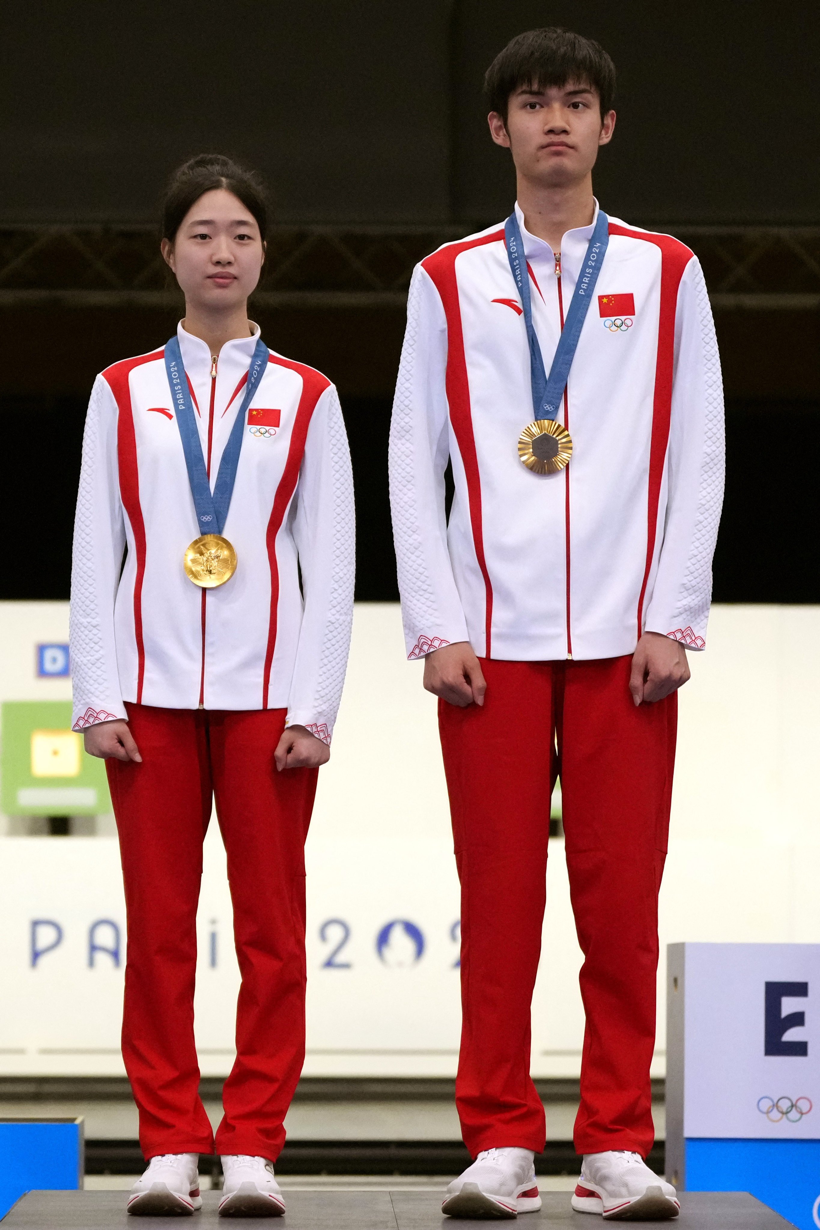 Huang Yuting (left) has attracted visitors to her Chinese village after clinching gold with 10m air rifle mixed doubles with Sheng Lihao. Photo: Reuters