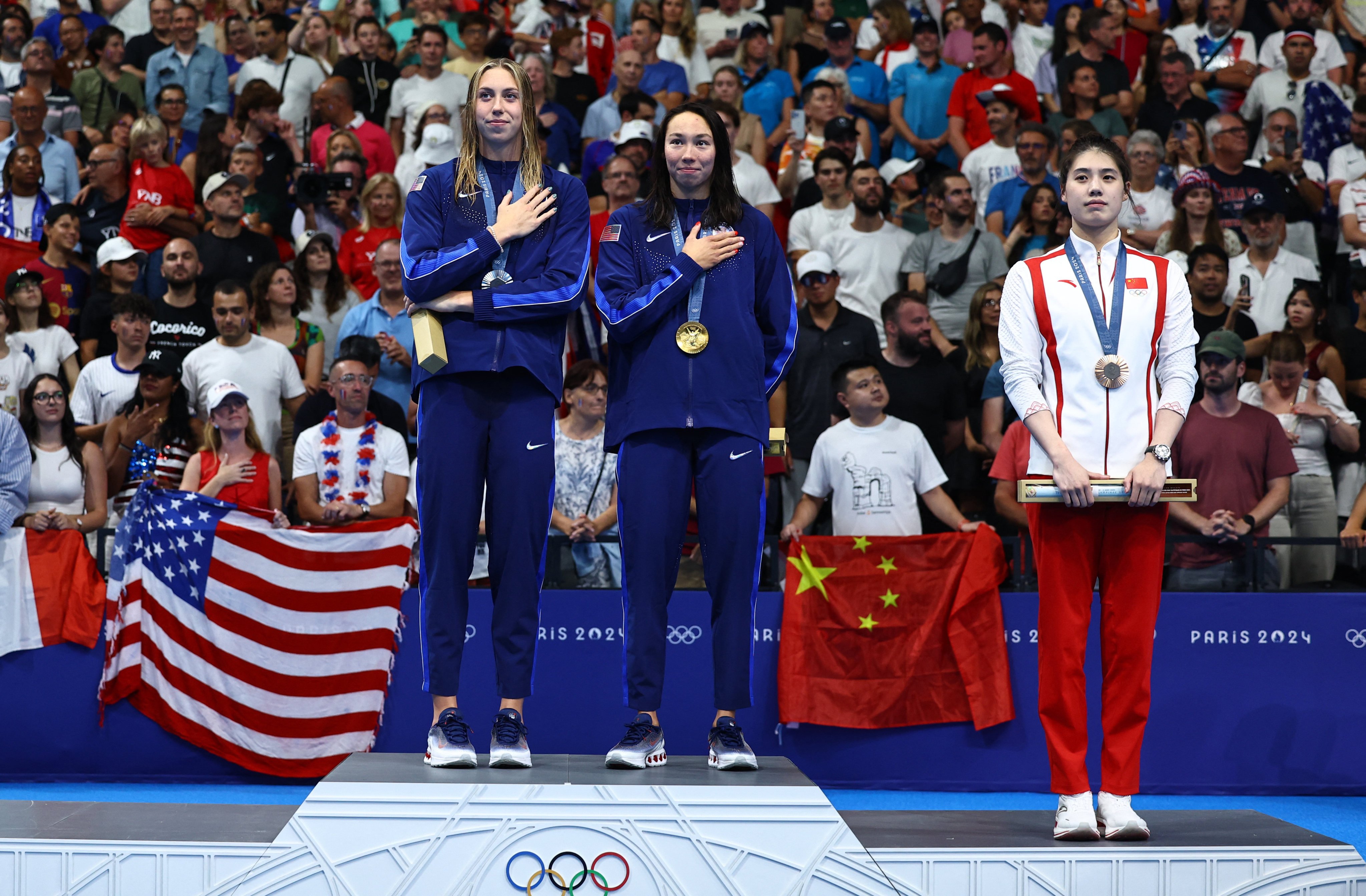 China’s Yufei Zhang (right) won the bronze medal as United States pair Torri Huske (centre) won the gold and Gretchen Walsh the silver in the women’s 100m butterfly. Photo: Reuters