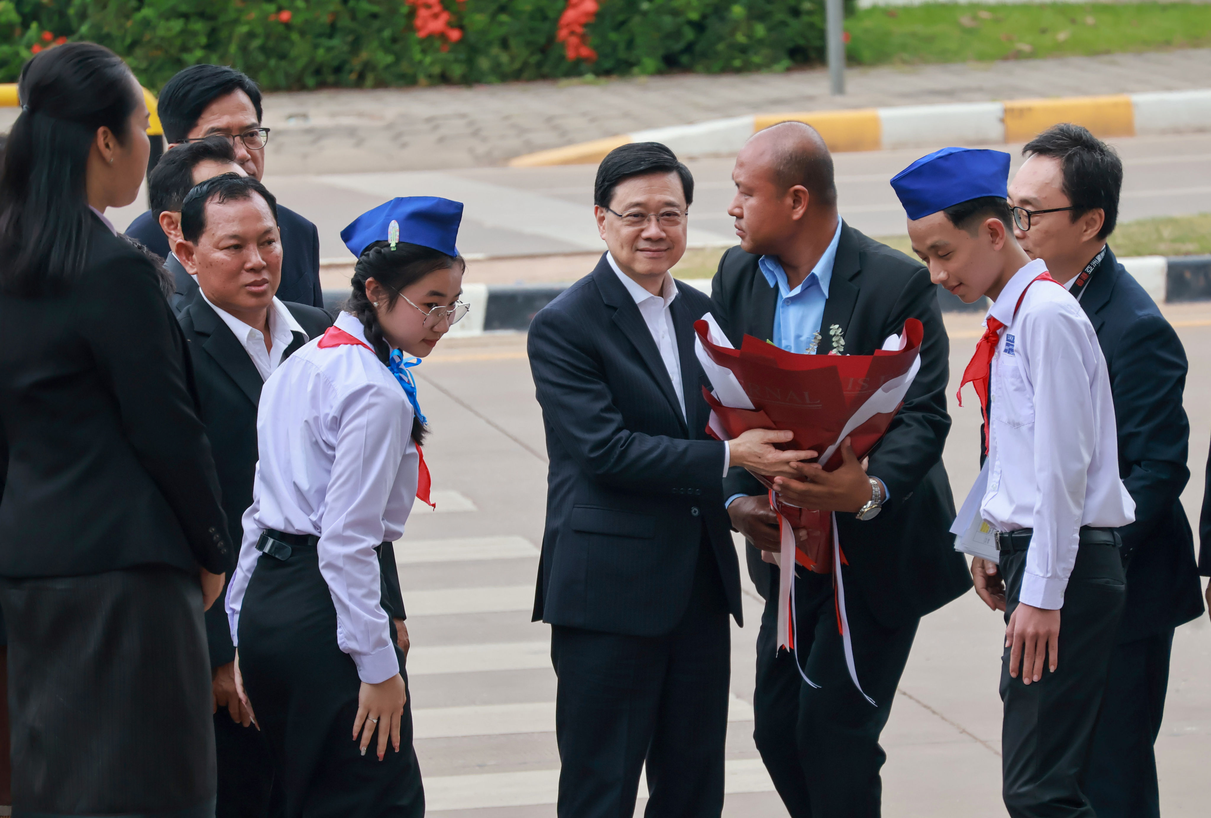 Chief Executive John Lee visits Vientiane Secondary School in Laos on Monday. Photo: Kahon Chan