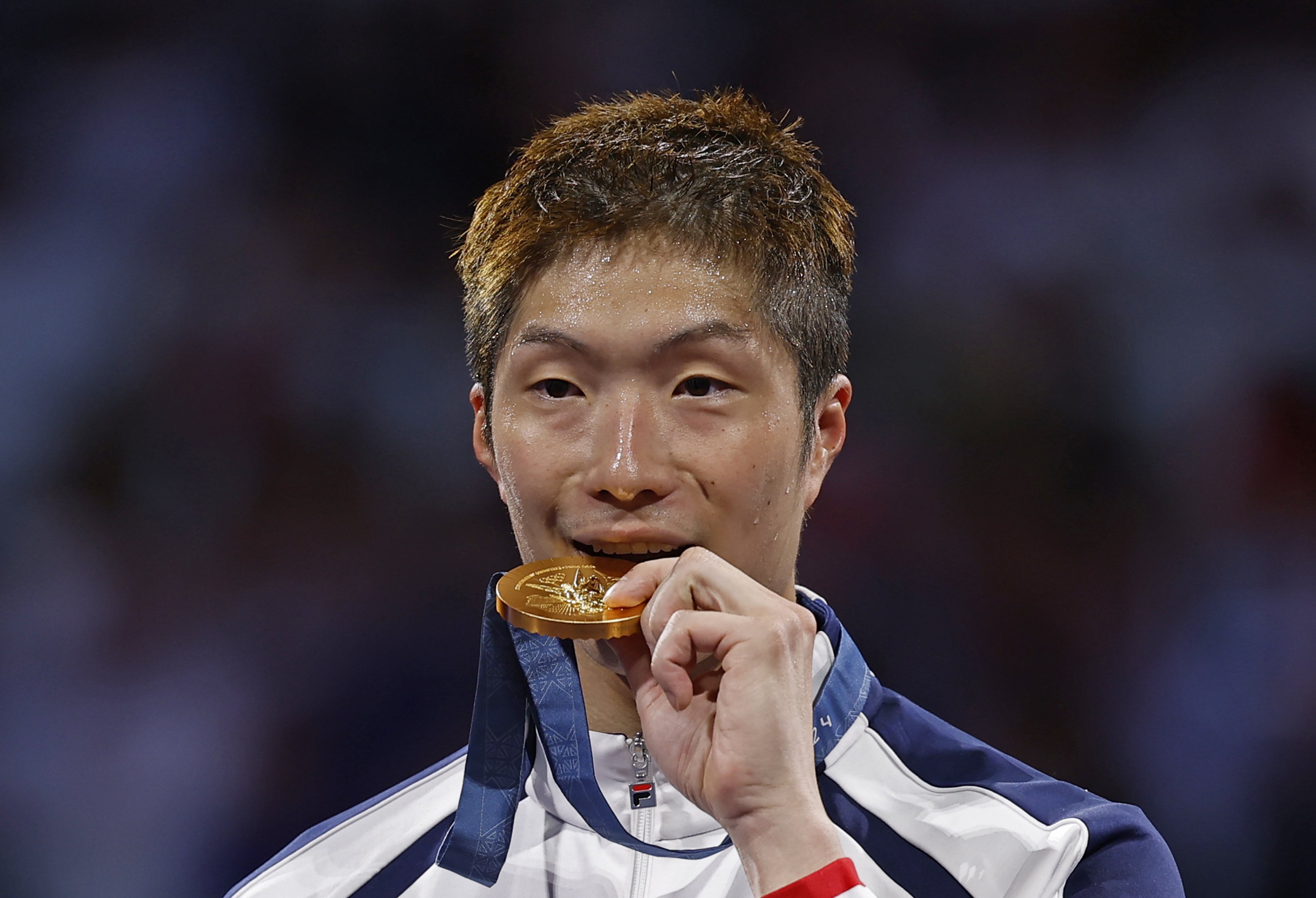 Cheung Ka-long receives his Olympic gold medal after winning the men’s foil title in Paris. Photo: EPA-EFE