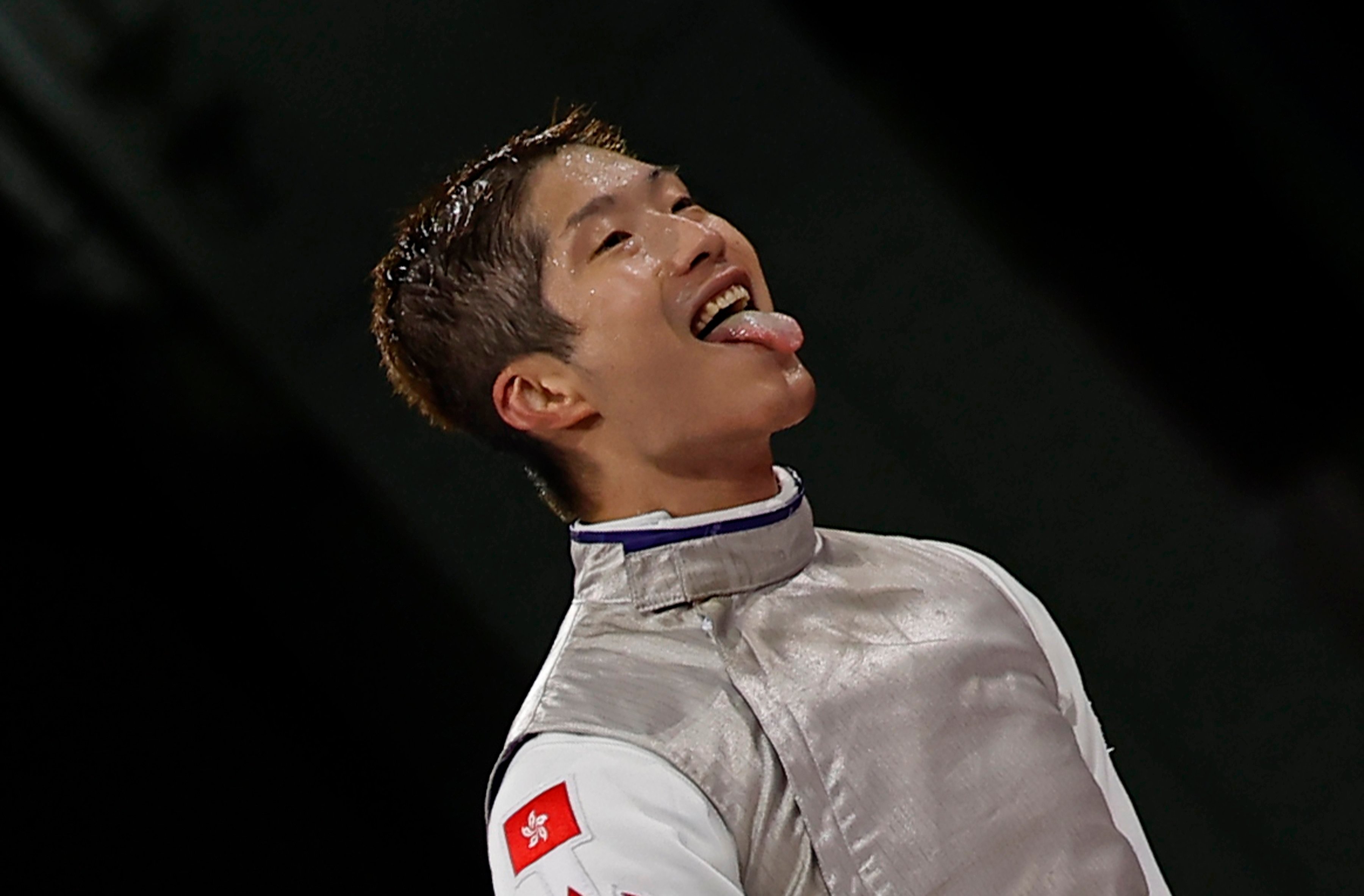 Cheung Ka-long offers his trademark tongue-out celebration after winning his Olympic semi-final at the Grand Palais in Paris. Photo: EPA-EFE