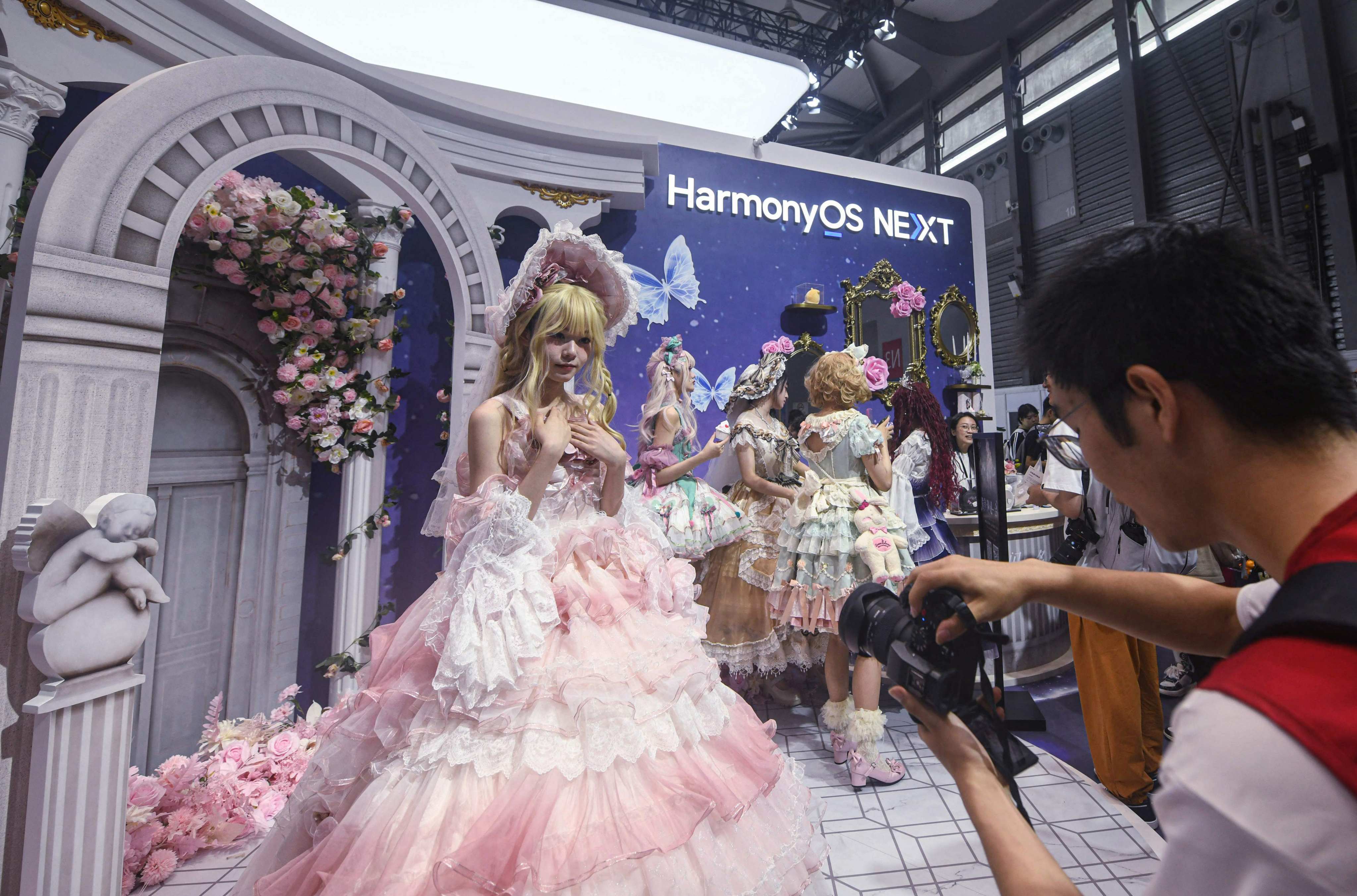 A cosplayer poses for photos at the booth of Huawei Technologies’ HarmonyOS Next mobile platform at the opening of the annual ChinaJoy expo in Shanghai on July 26, 2024. Photo: AFP