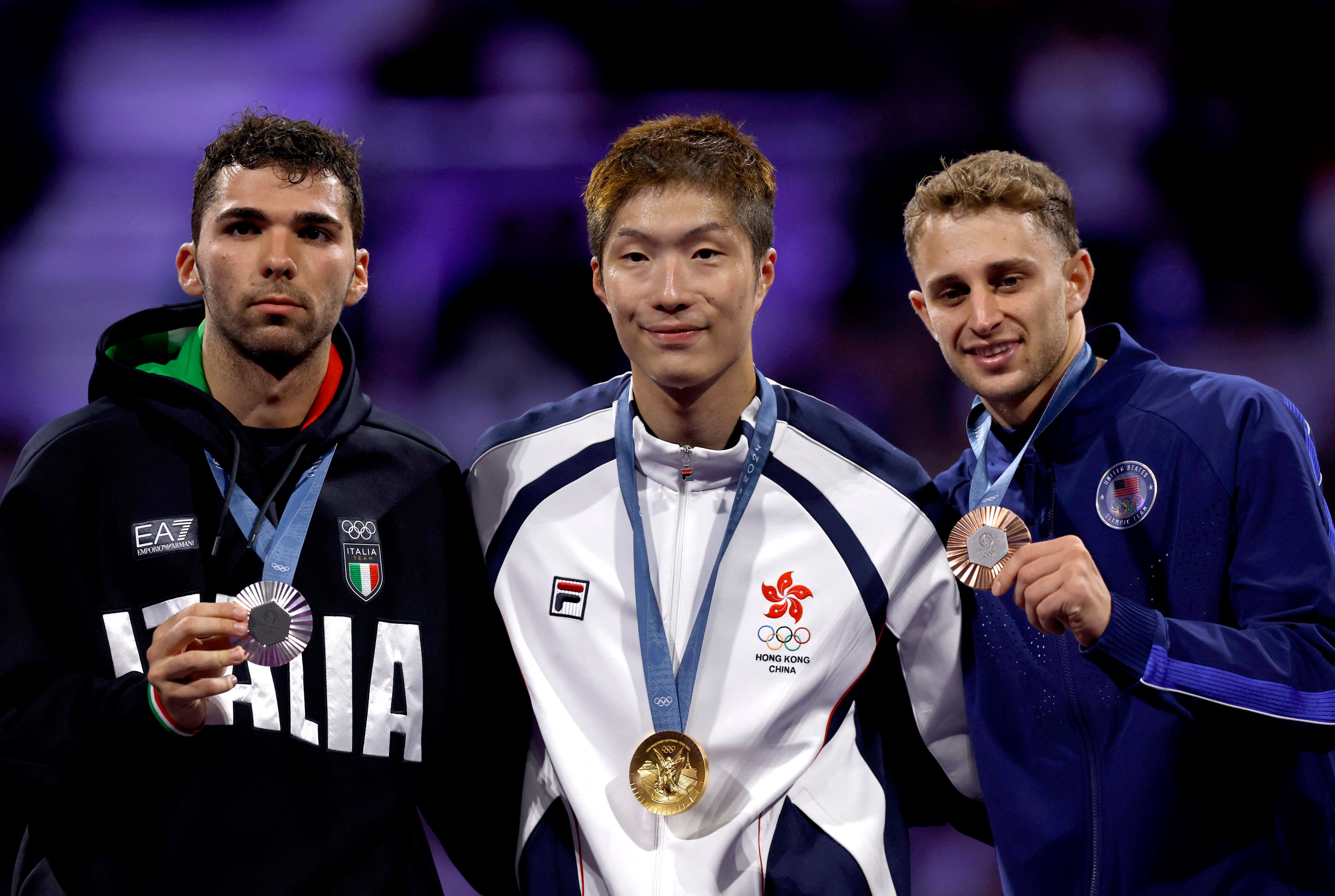 Cheung Ka-long (centre) wears his gold medal around his neck with Italy’s Filippo Macchi (left) settling for the silver. Photo: Reuters