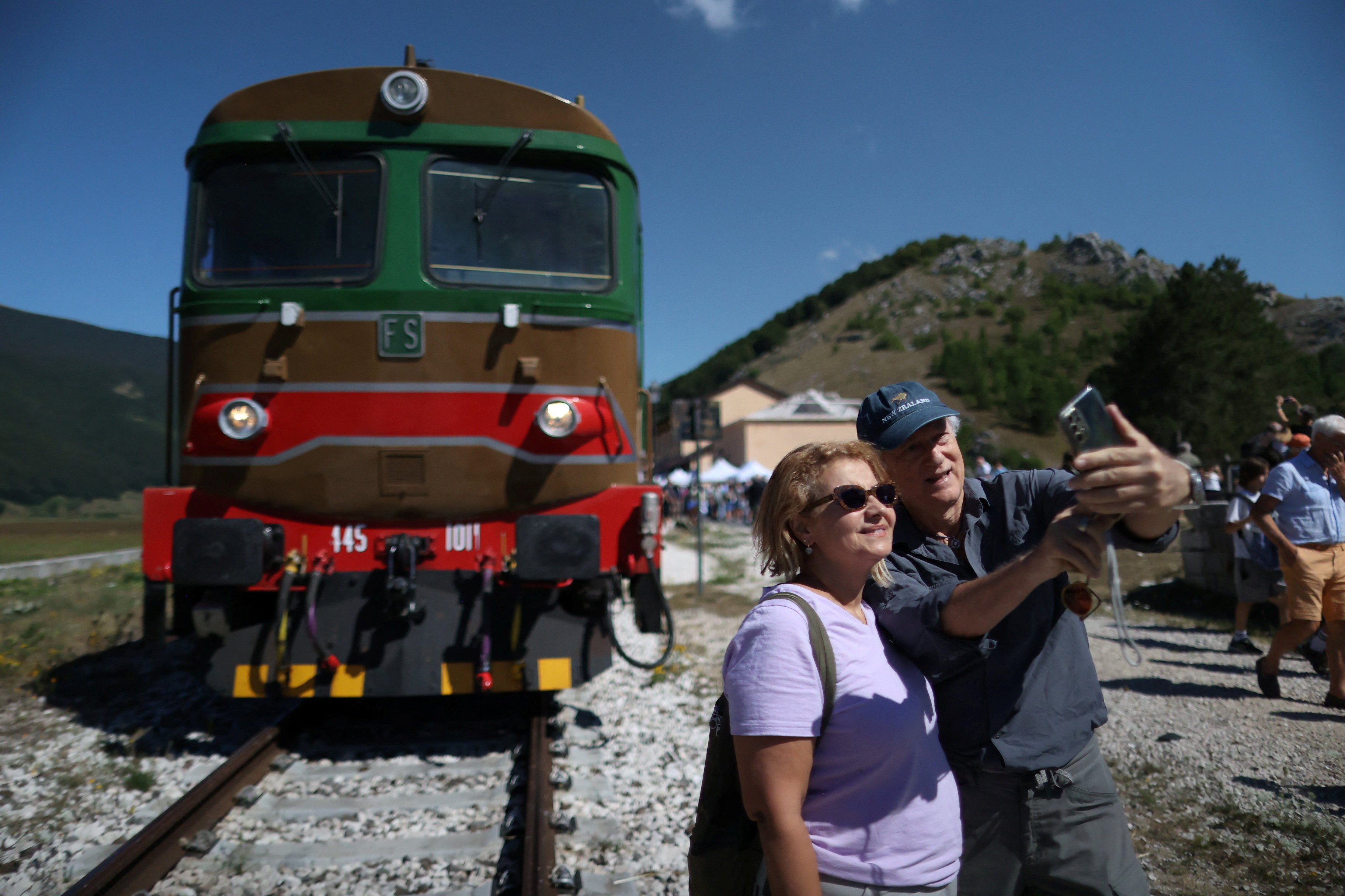 Tourists in front of an old train on Italy’s “Trans-Siberian Railway”. Photo: Reuters