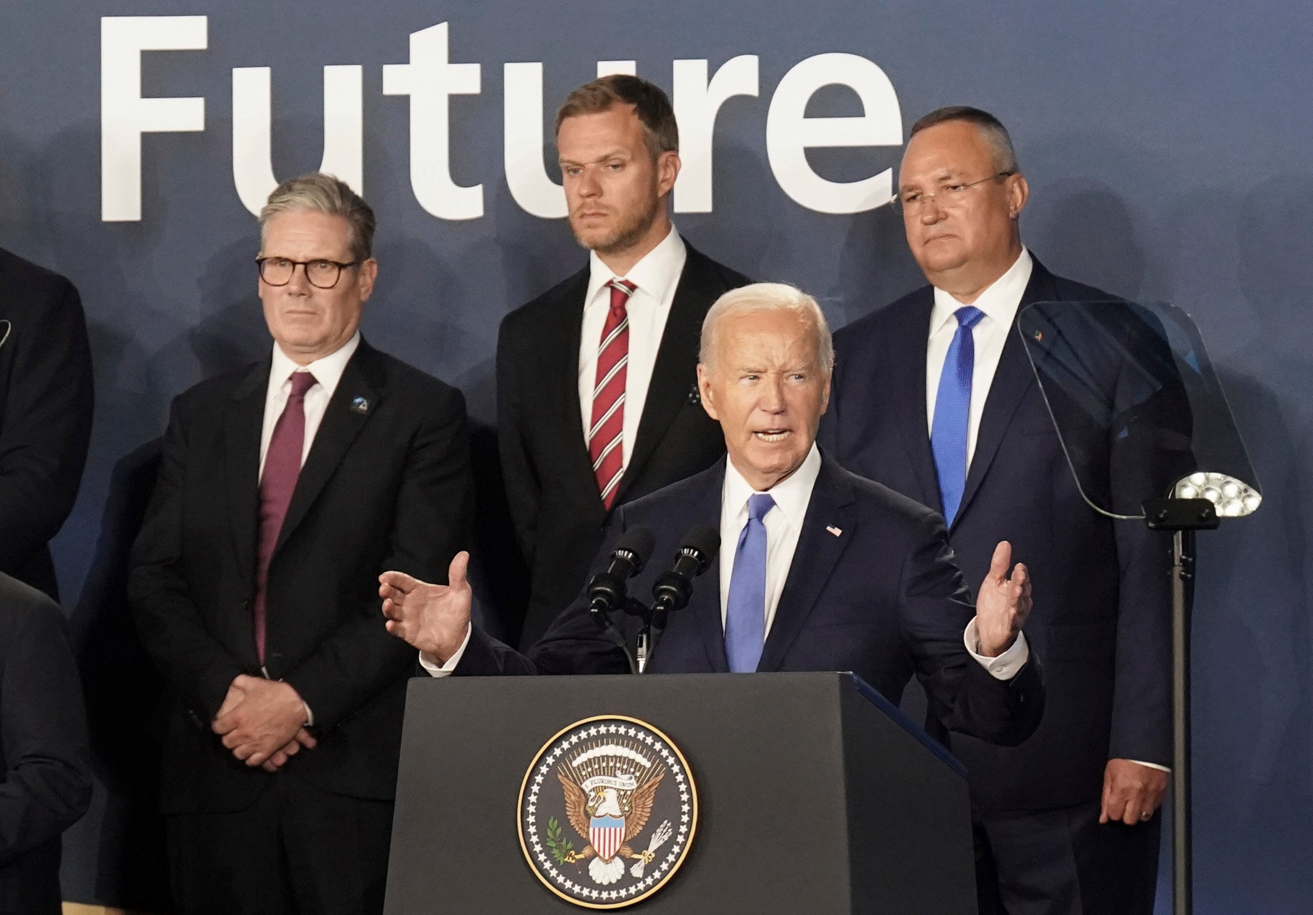 British Prime Minister Keir Starmer (left) looks on as US President Joe Biden speaks during an event at the Nato summit in Washington on July 11. Alliances built with national security at their core are increasingly out of step with the demands of a world in need of improved human security. Photo: AP