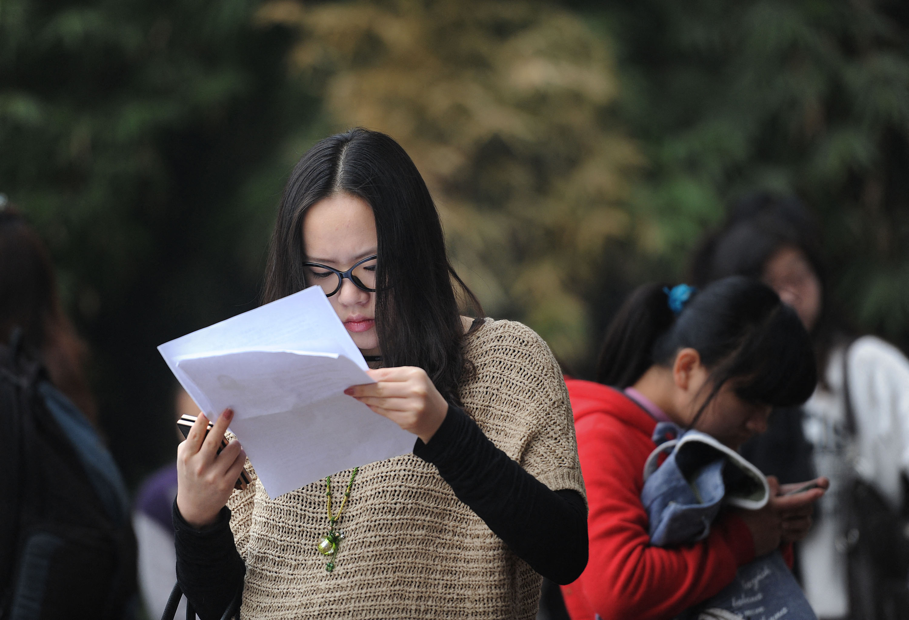 A candidate makes last-minute preparations to sit for a Chinese civil service examination. Photo: AFP