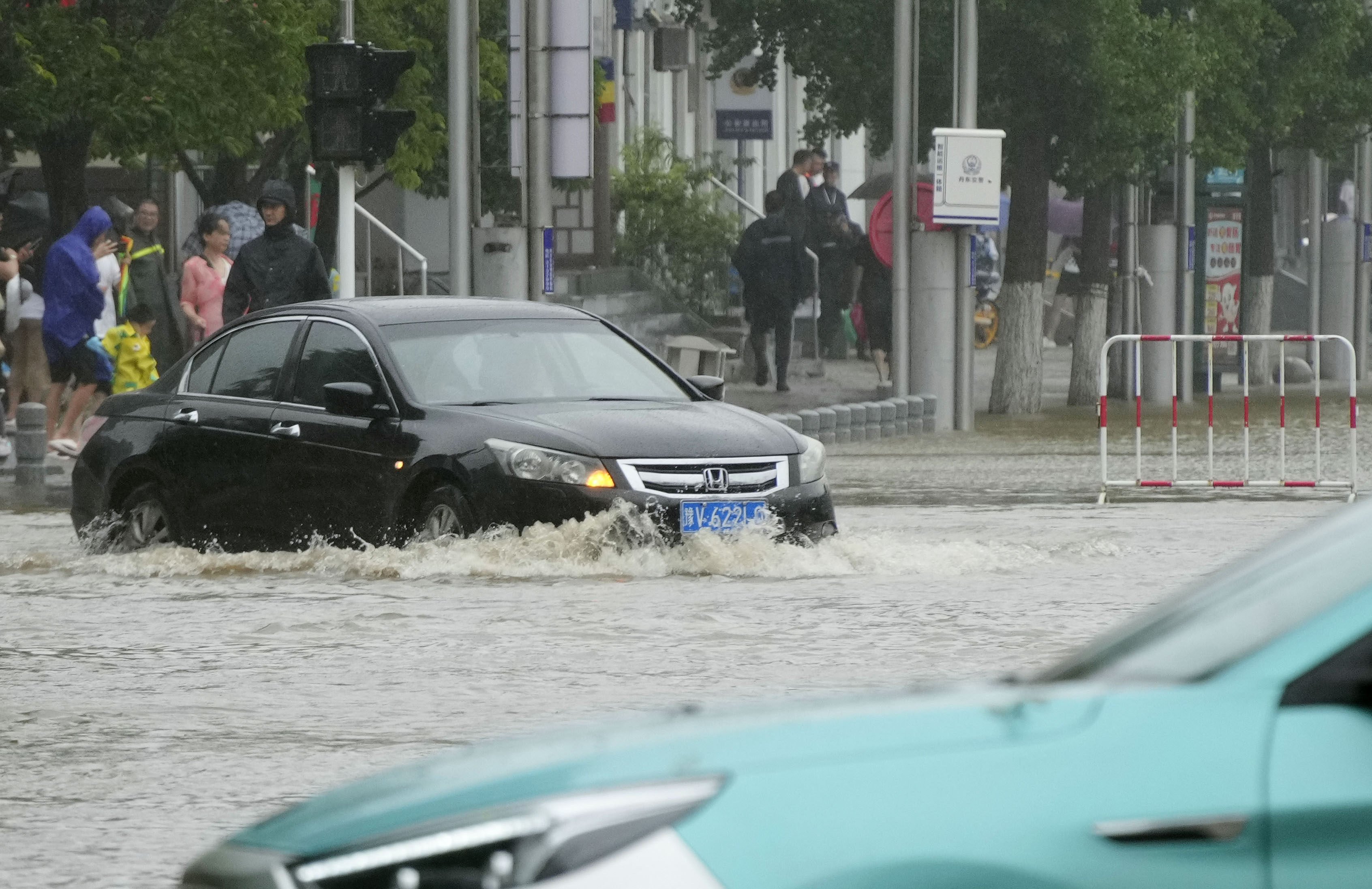 A street in Dandong, China, is flooded on Sunday. Photo: Kyodo