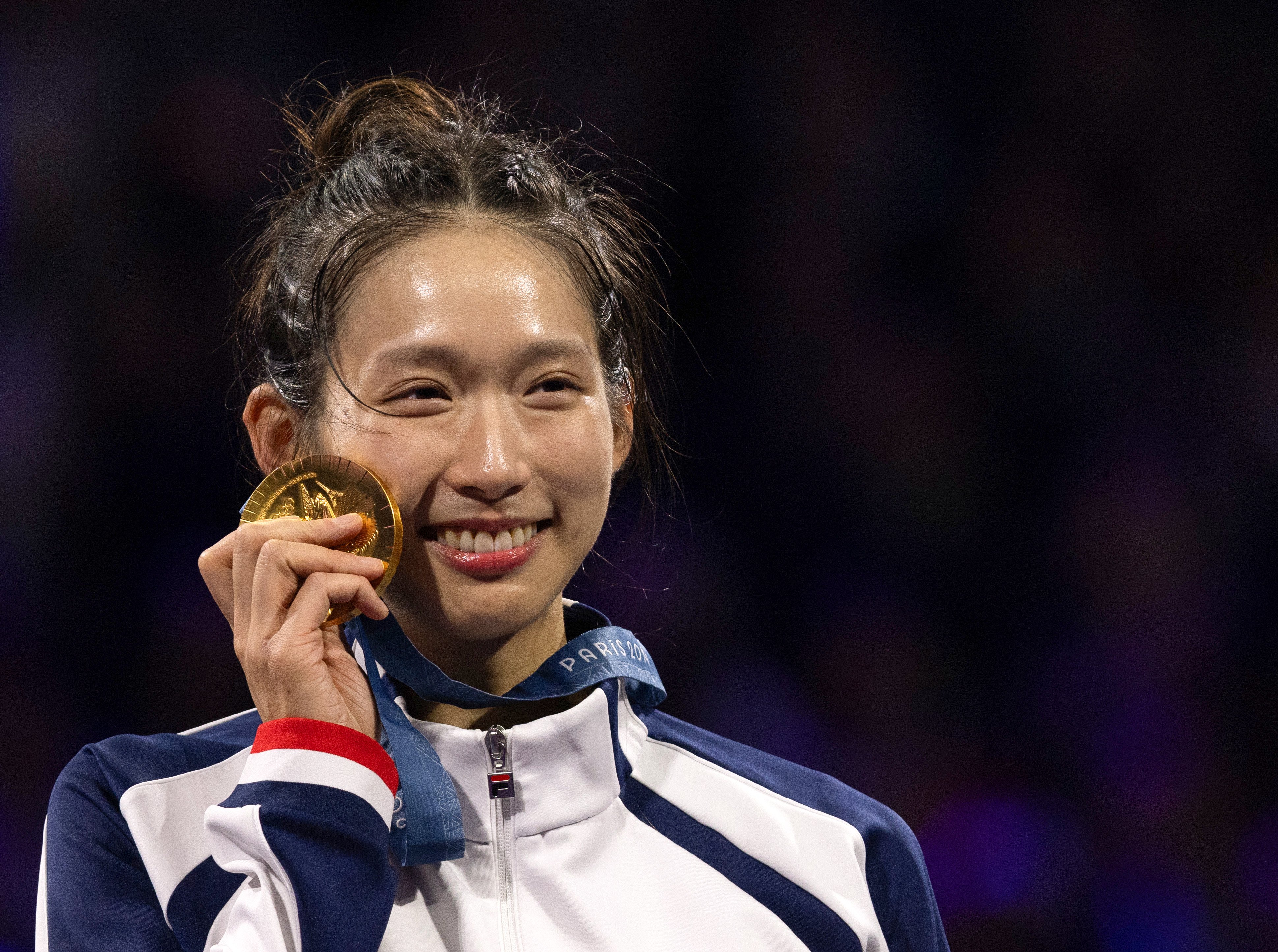 Hong Kong fencer Vivian Kong celebrates after winning a gold medal at the Paris Olympics on July 27. Photo: Getty Images