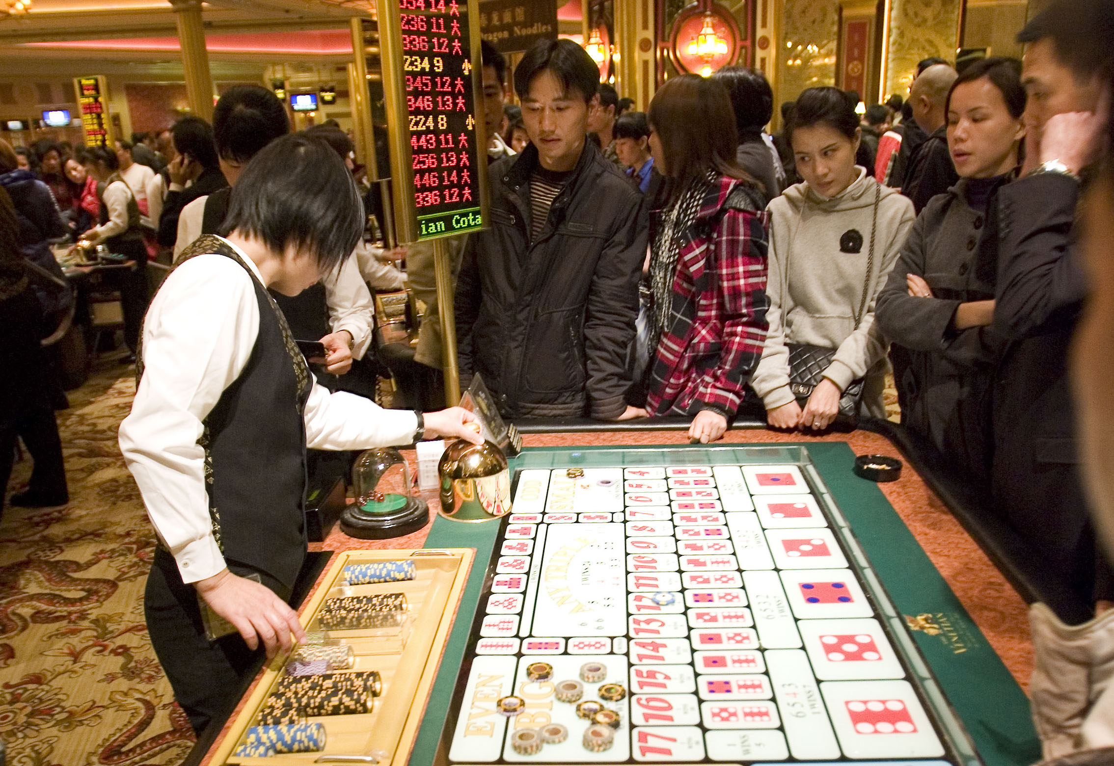 Gamblers placing bets in a Macau casino. Photo: Getty Images