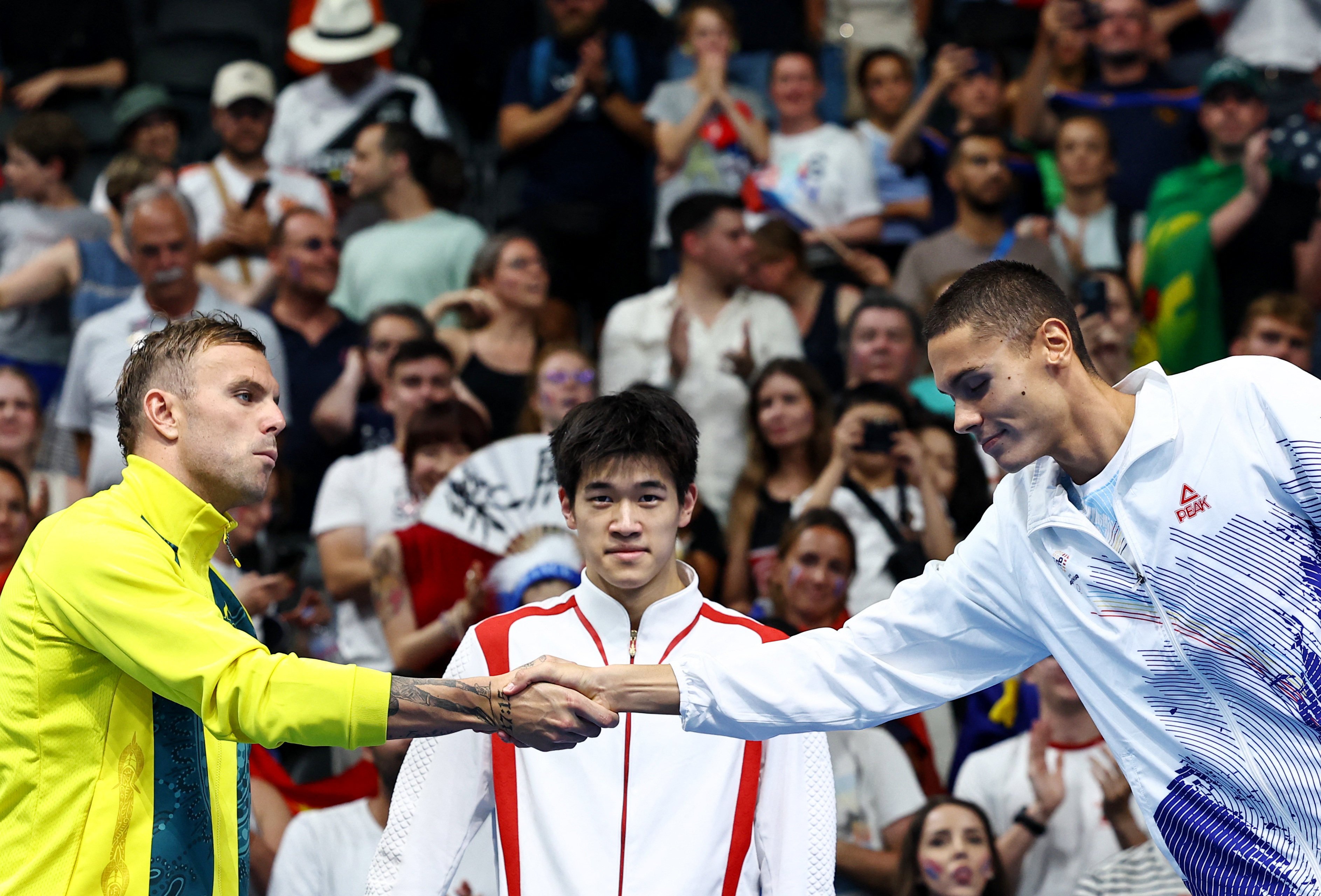 China’s Pan Zhanle (centre) won the gold medal in the 100m freestyle but the coach of Australia’s Kyle Chalmers (left) expressed suspicion. Photo: Reuters