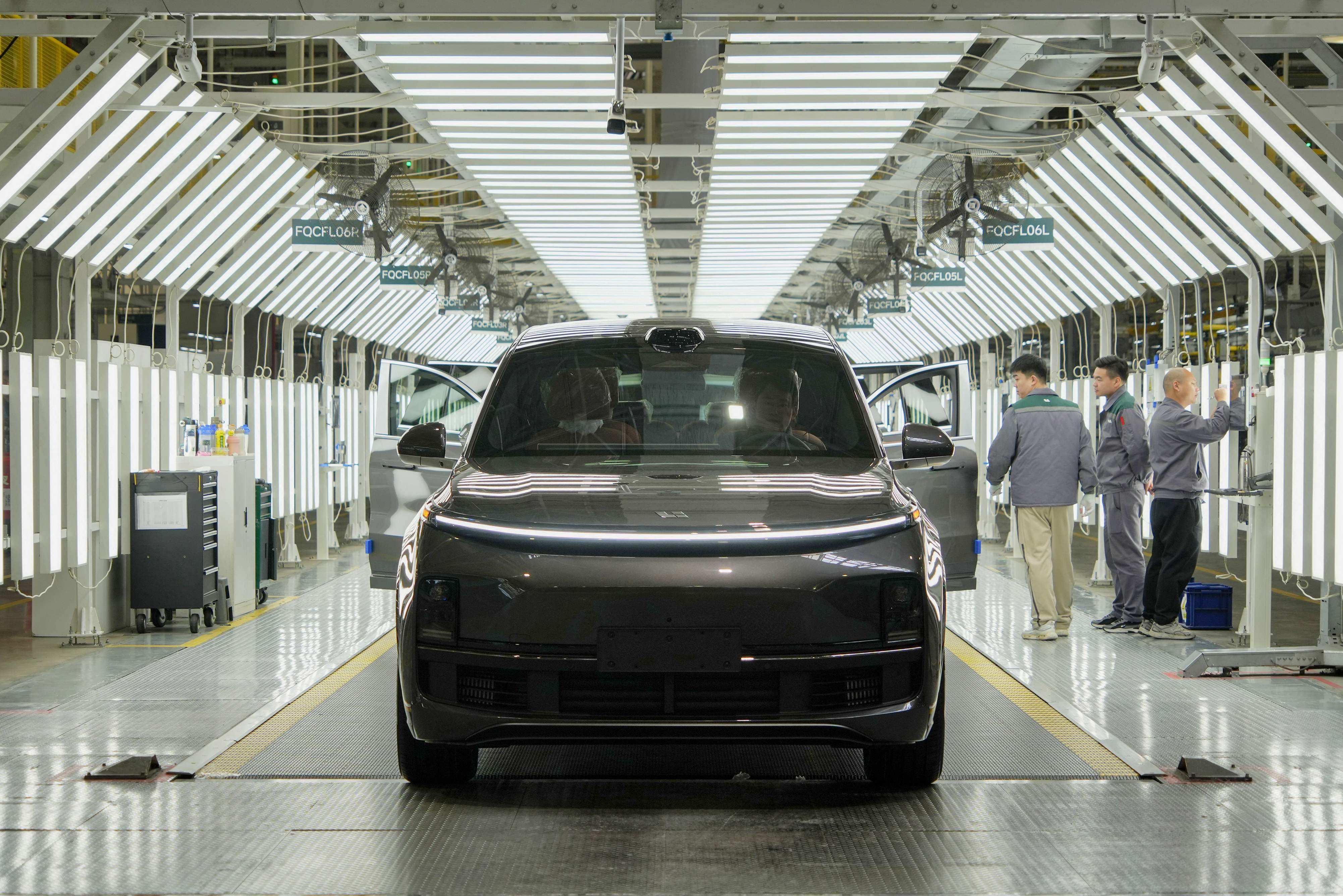 Employees work on an assembly line of Li Auto in Changzhou, in eastern China’s Jiangsu province. Photo: AFP