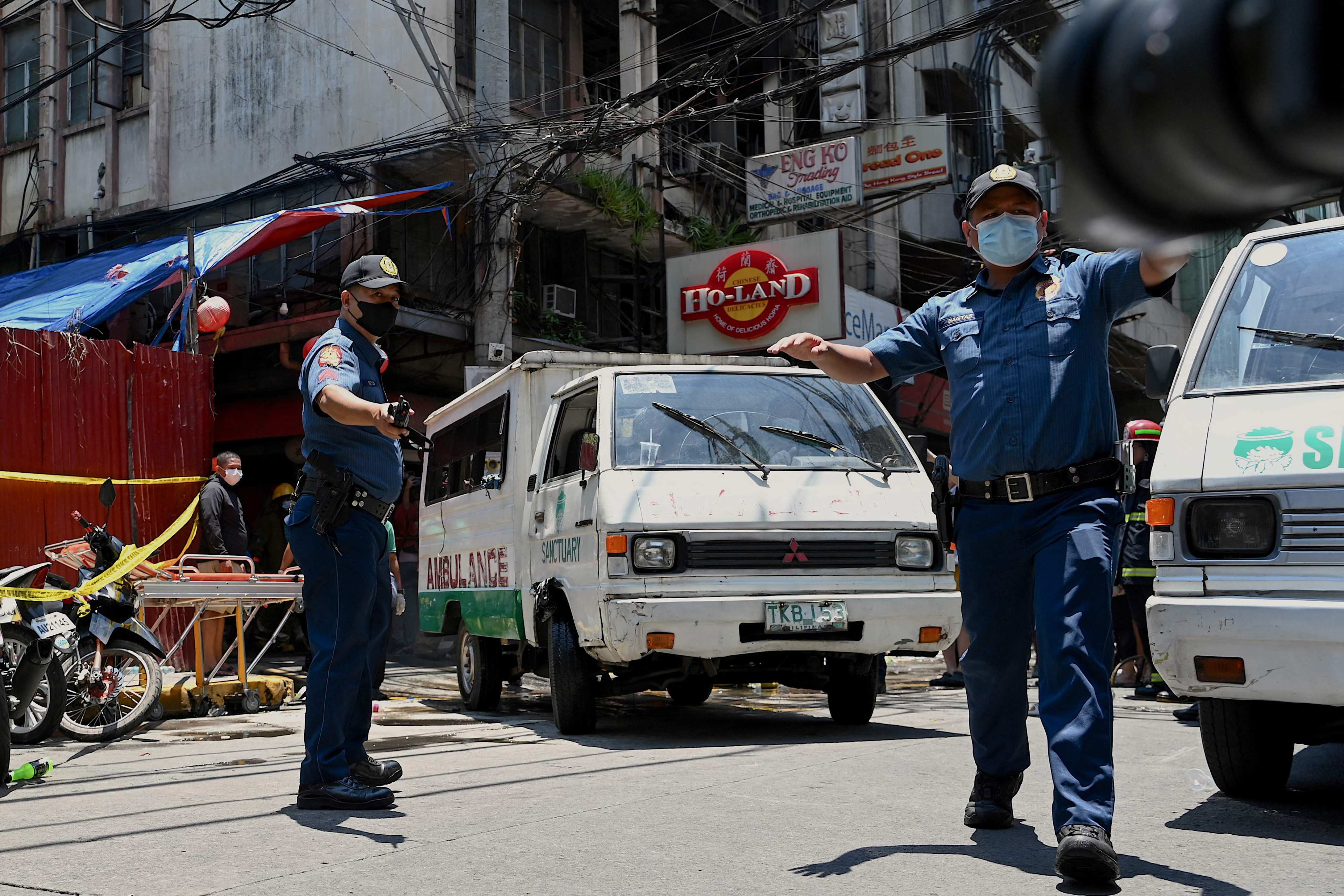 An ambulance leaves the scene of the fire. Photo: AFP