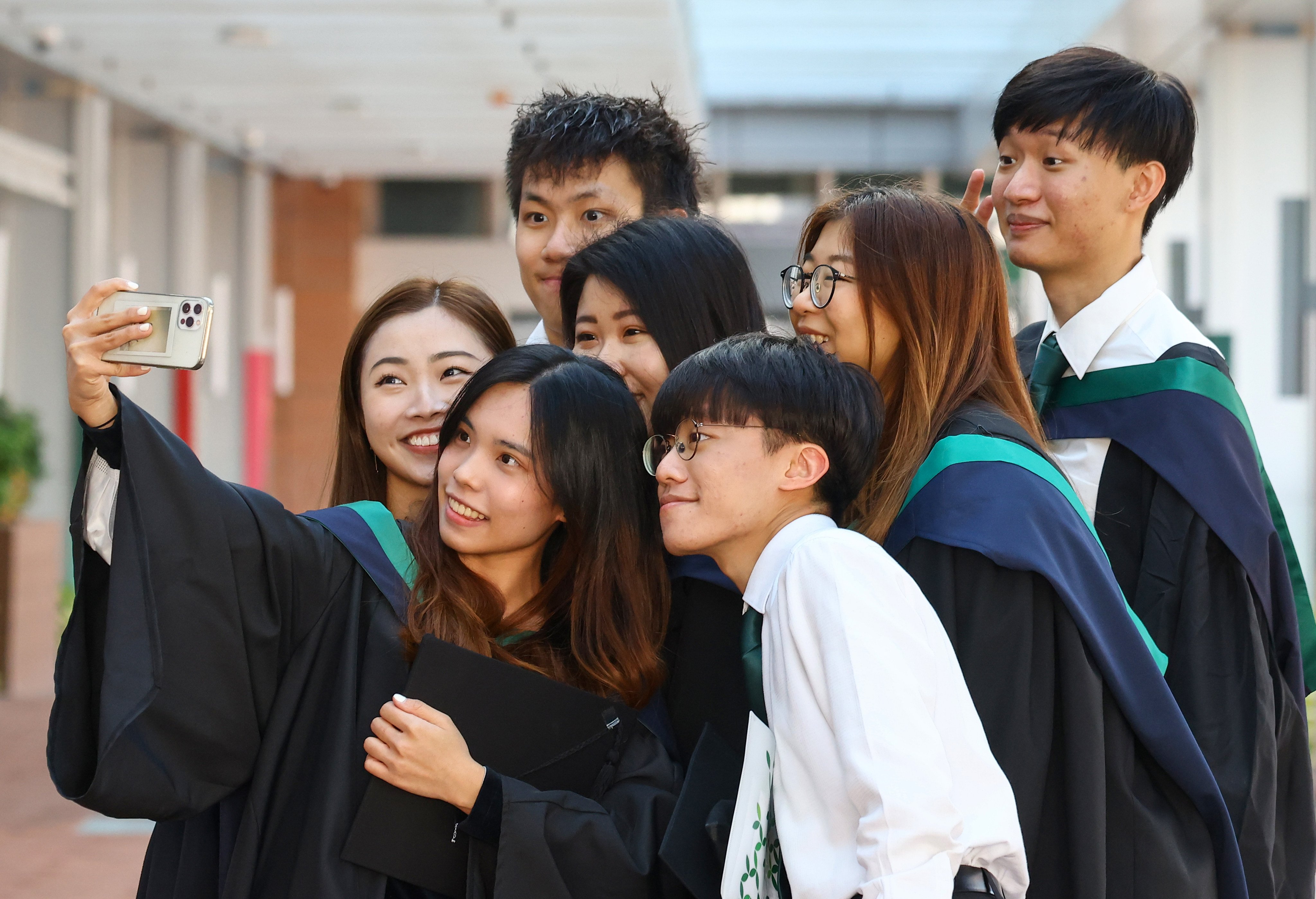 University of Hong Kong graduates, revealed to be the highest earning after they finish their degrees, celebrate after the awards ceremony. Photo: Dickson Lee