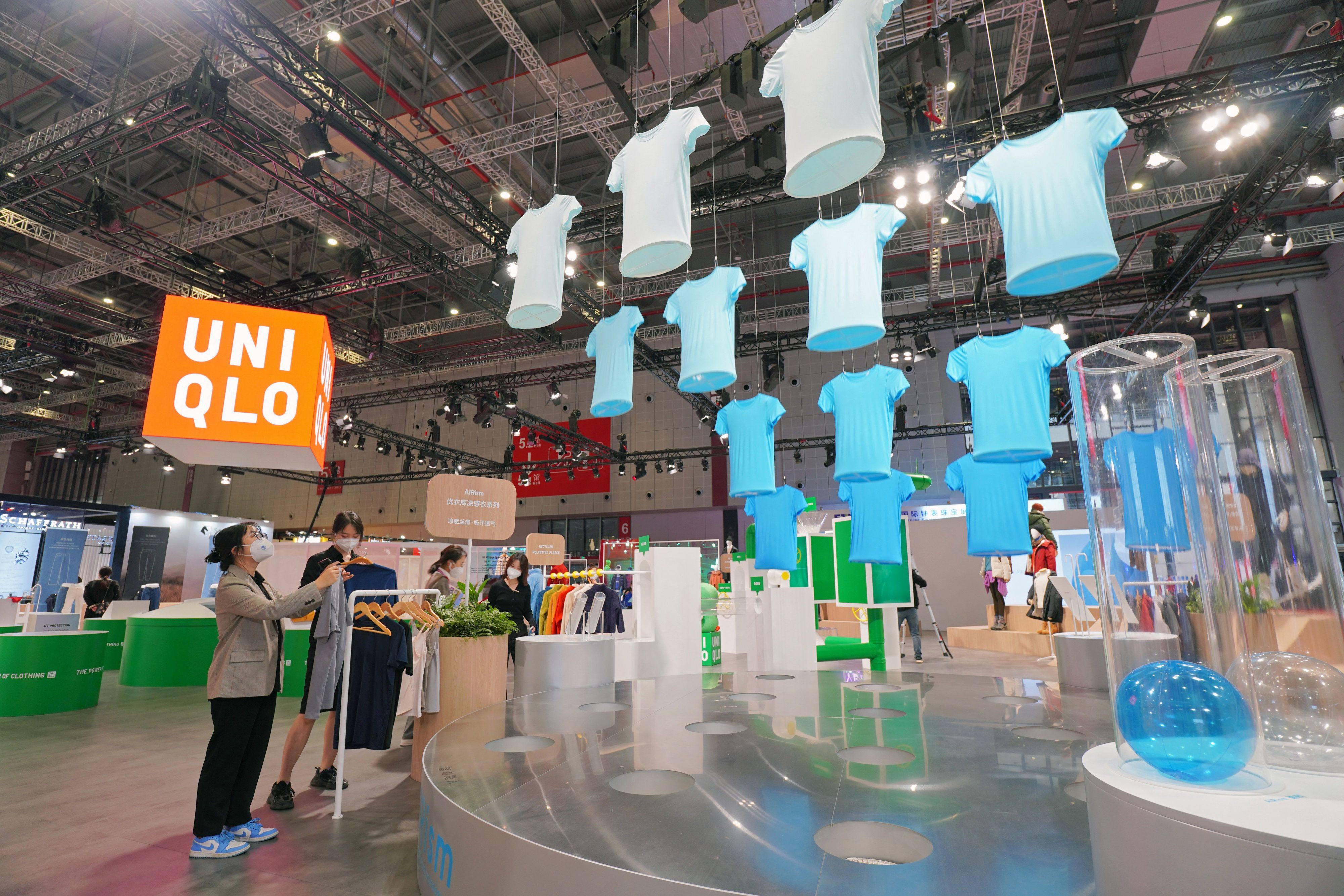 People visiting the Uniqlo stand during the 5th China International Import Expo in Shanghai in November 2022. Photo by AFP