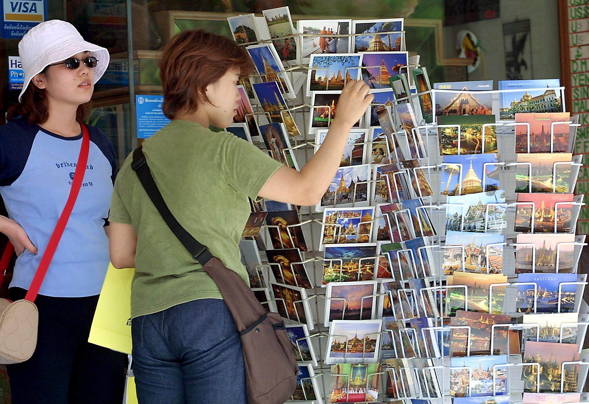 Postcards have been losing popularity for years, with travellers choosing to share photos online, but millennials are keeping the tradition of sending them alive, mailing more than any other section of the population, according to a British survey. Photo: AFP