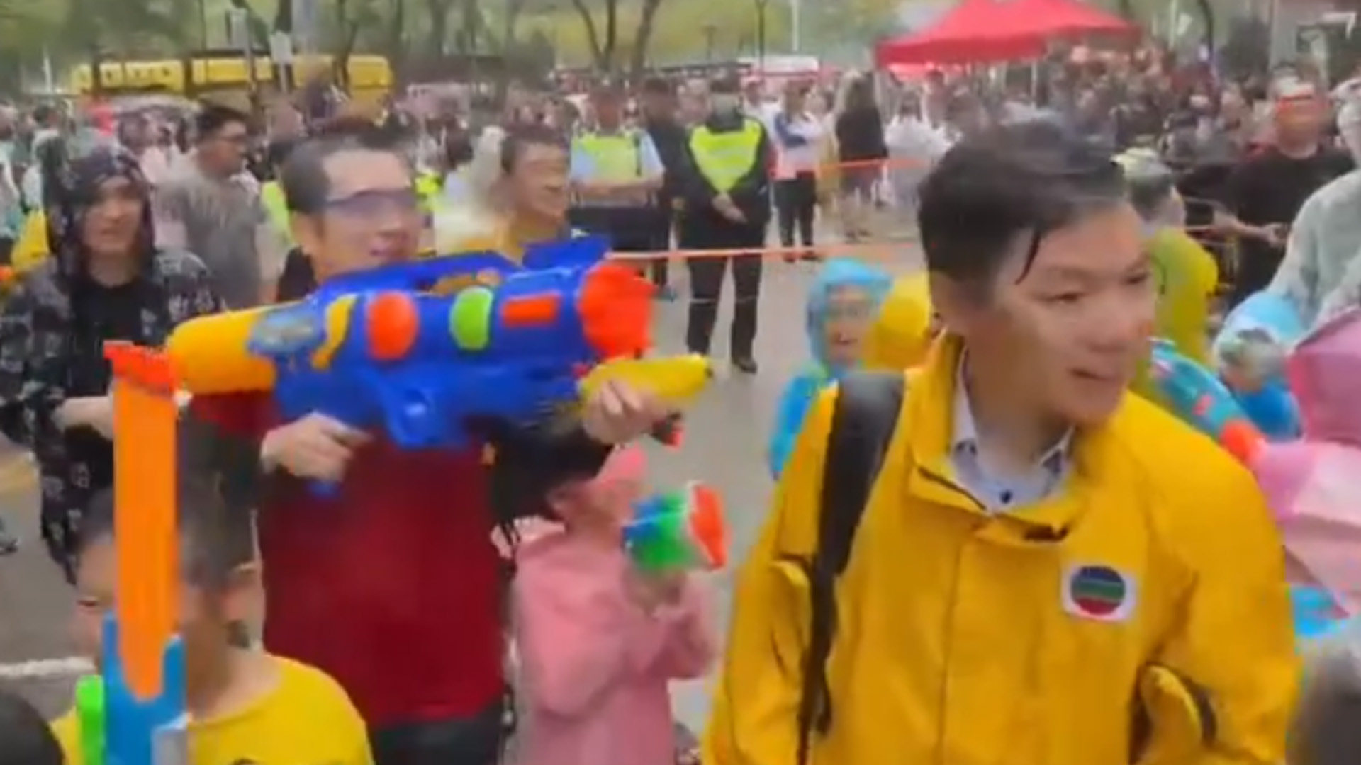 A video screengrab shows TVB reporter Timothy Li (right) being splashed with water.in Kowloon City. Photo: Handout