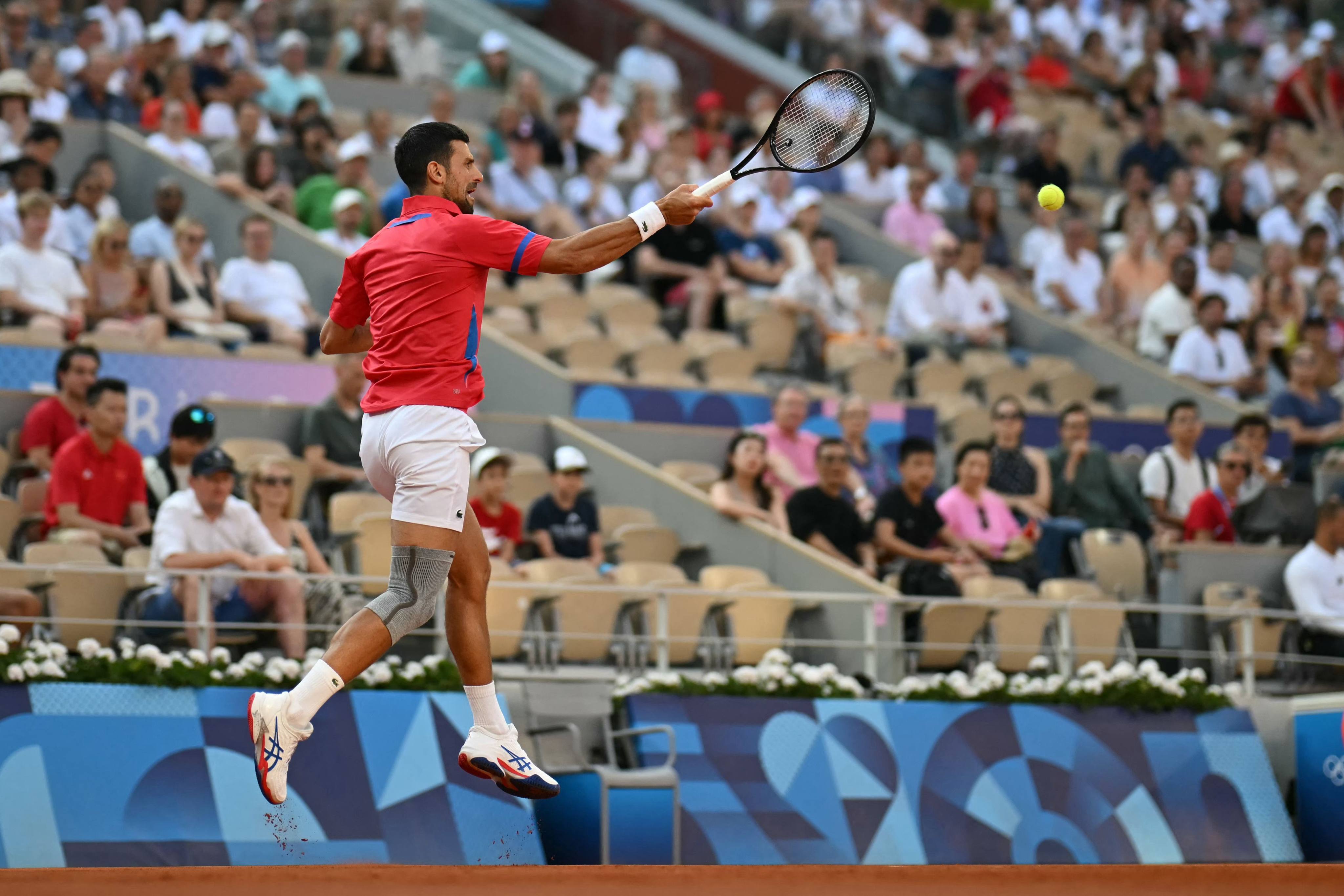 Serbia’s Novak Djokovic returns to Italy’s Lorenzo Musetti during their men’s singles semi-final at Roland Garros. Photo: AFP