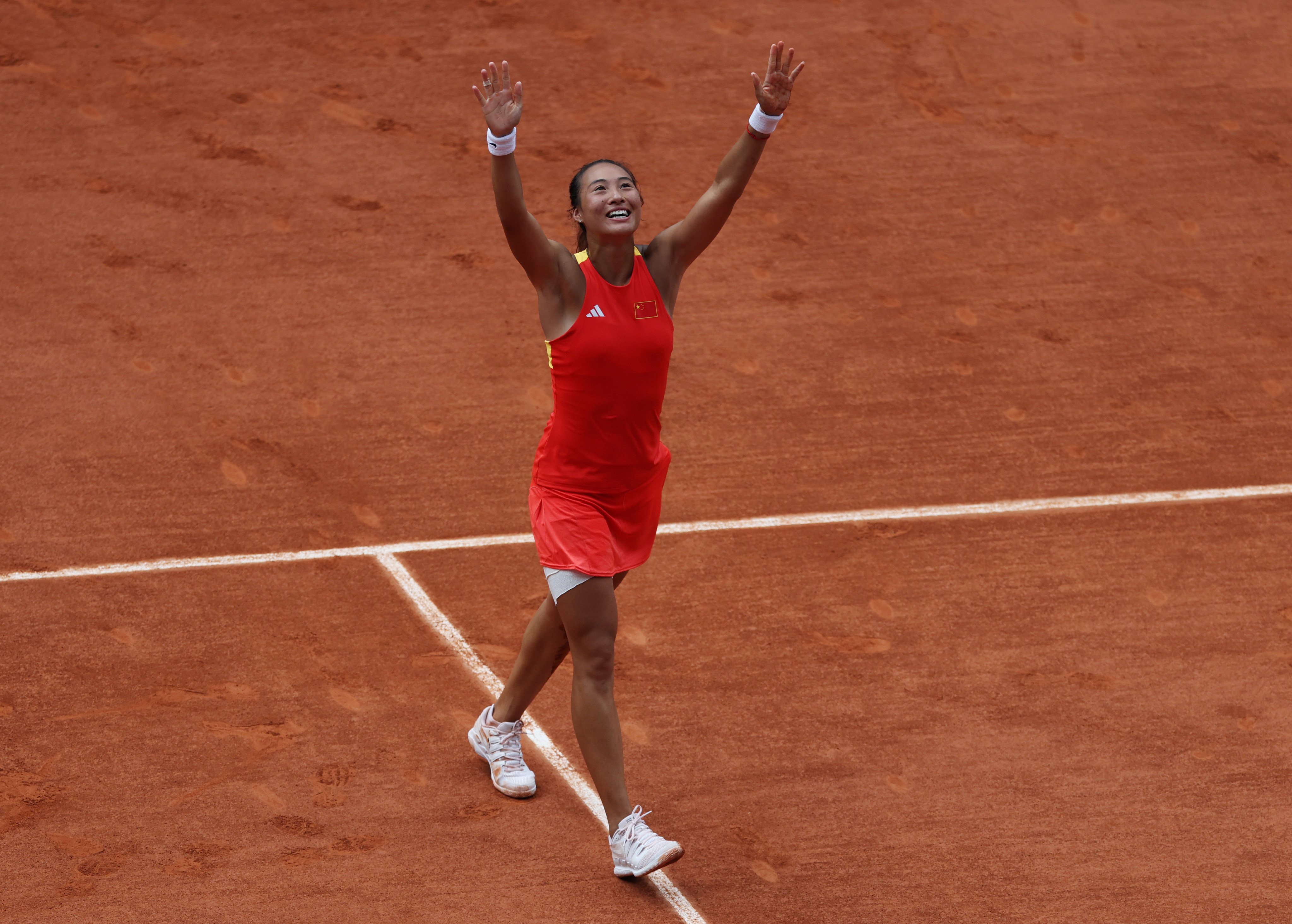 Zheng Qinwen is the first Asian-born player to reach an Olympic singles final. Photo: Xinhua