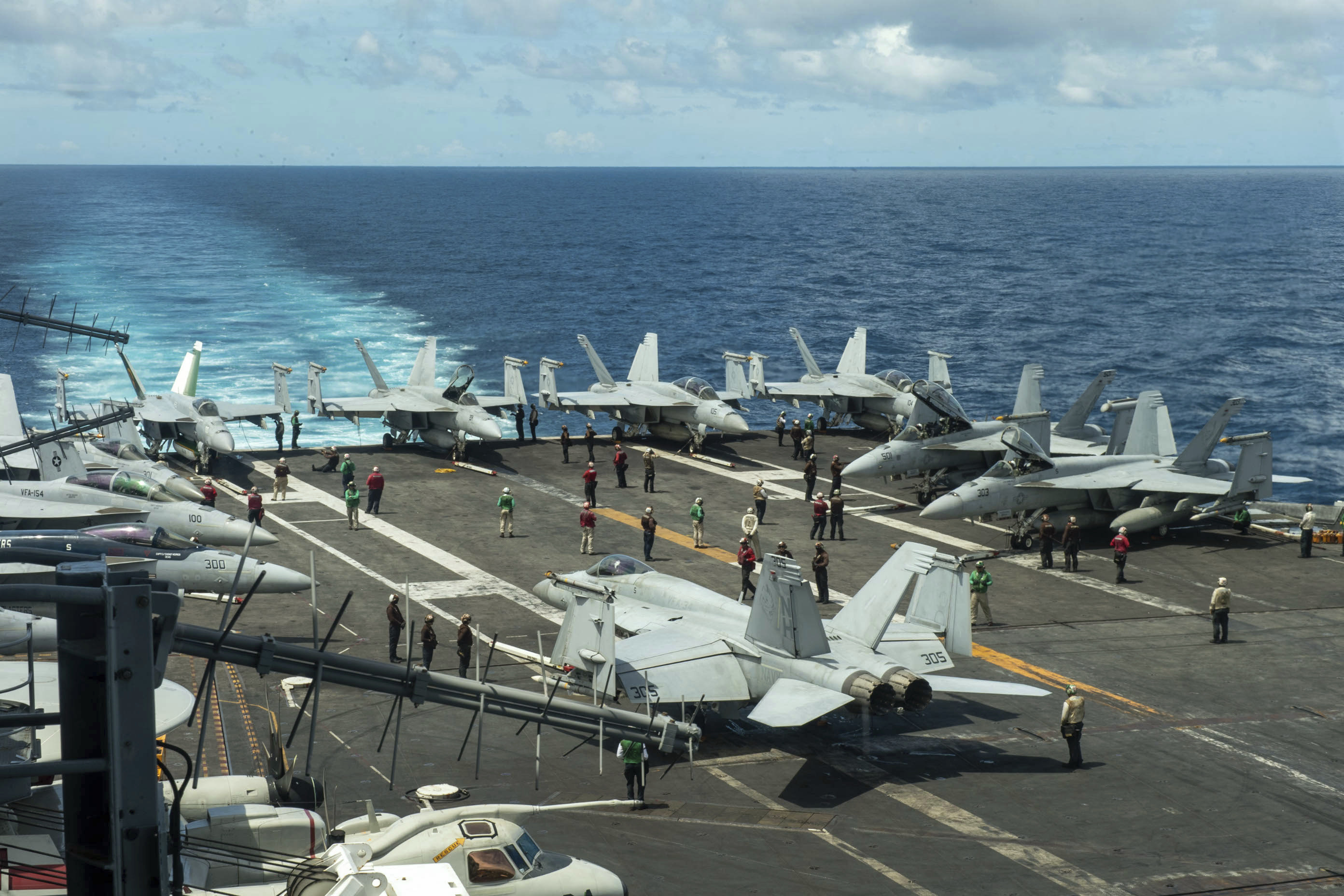 Aircraft are seen on the flight deck of the USS Theodore Roosevelt in the South China Sea in July. Photo: US Navy via AP