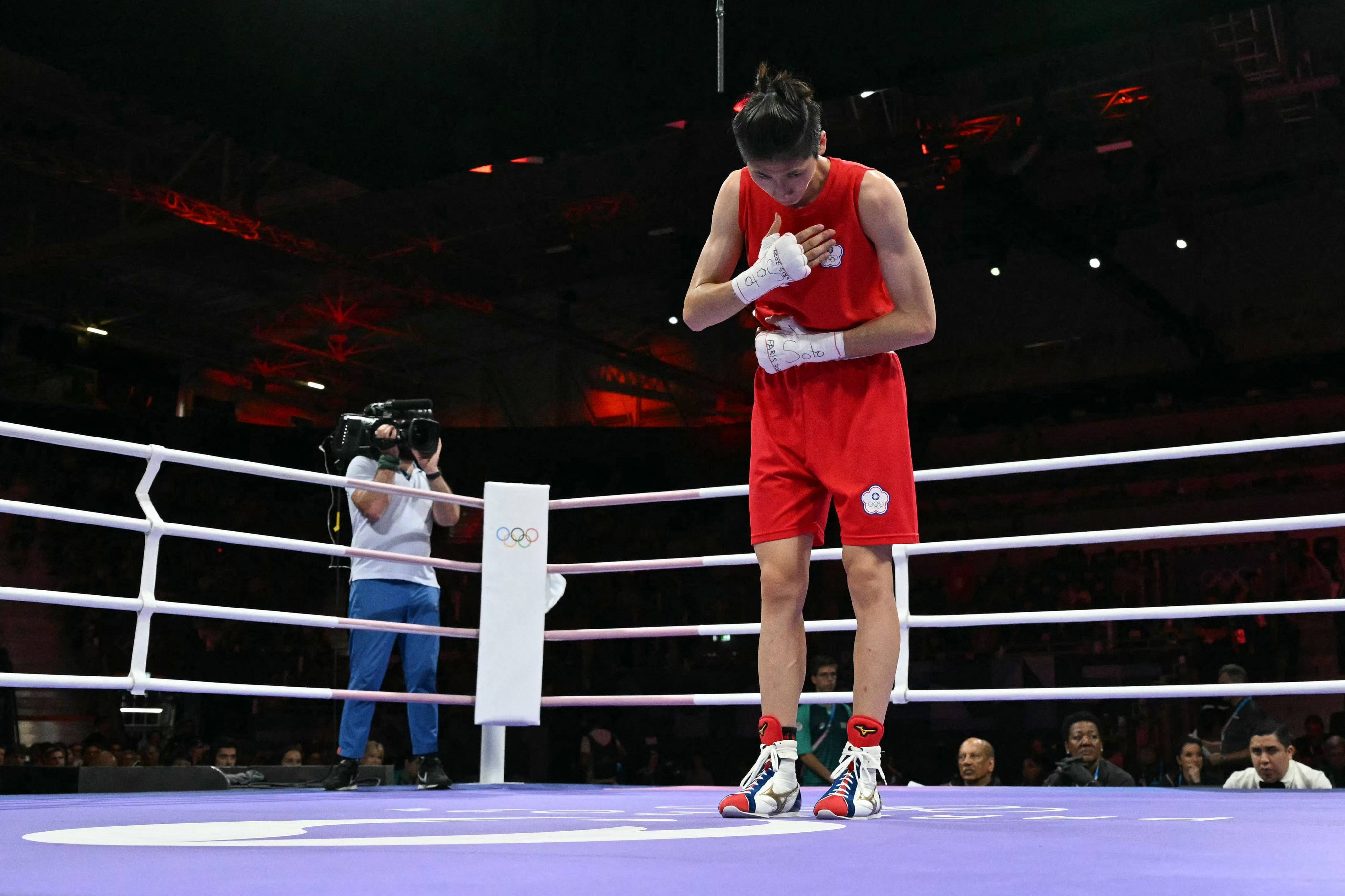 Taiwan’s Lin Yu-ting acknowledges the crowd after beating Bulgaria’s Svetlana Staneva in the women’s 57kg quarter-final. Photo: AFP