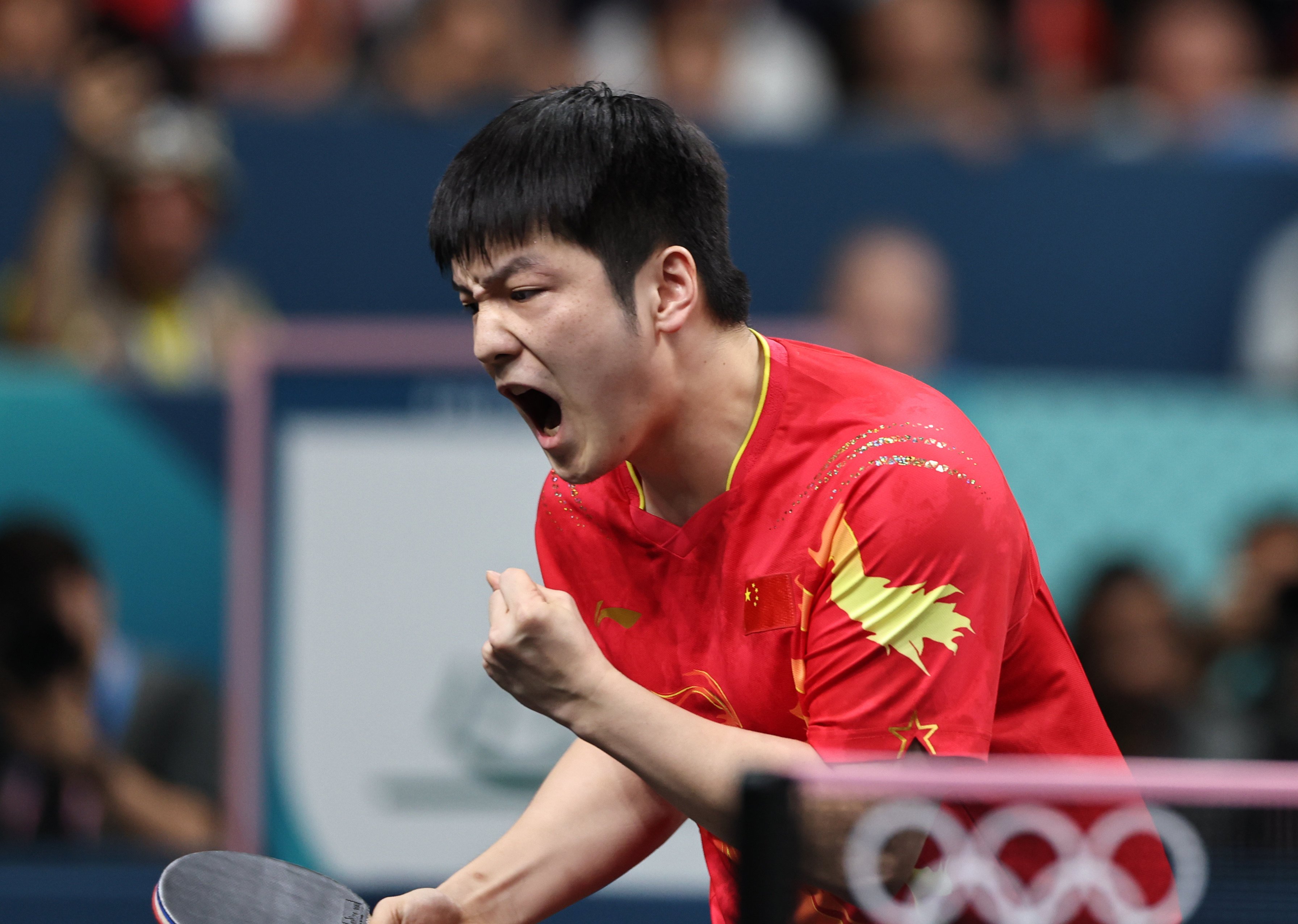 China’s Fan Zhendong celebrates winning a point during his gold medal match against Truls Moregard. Photo: Xinhua