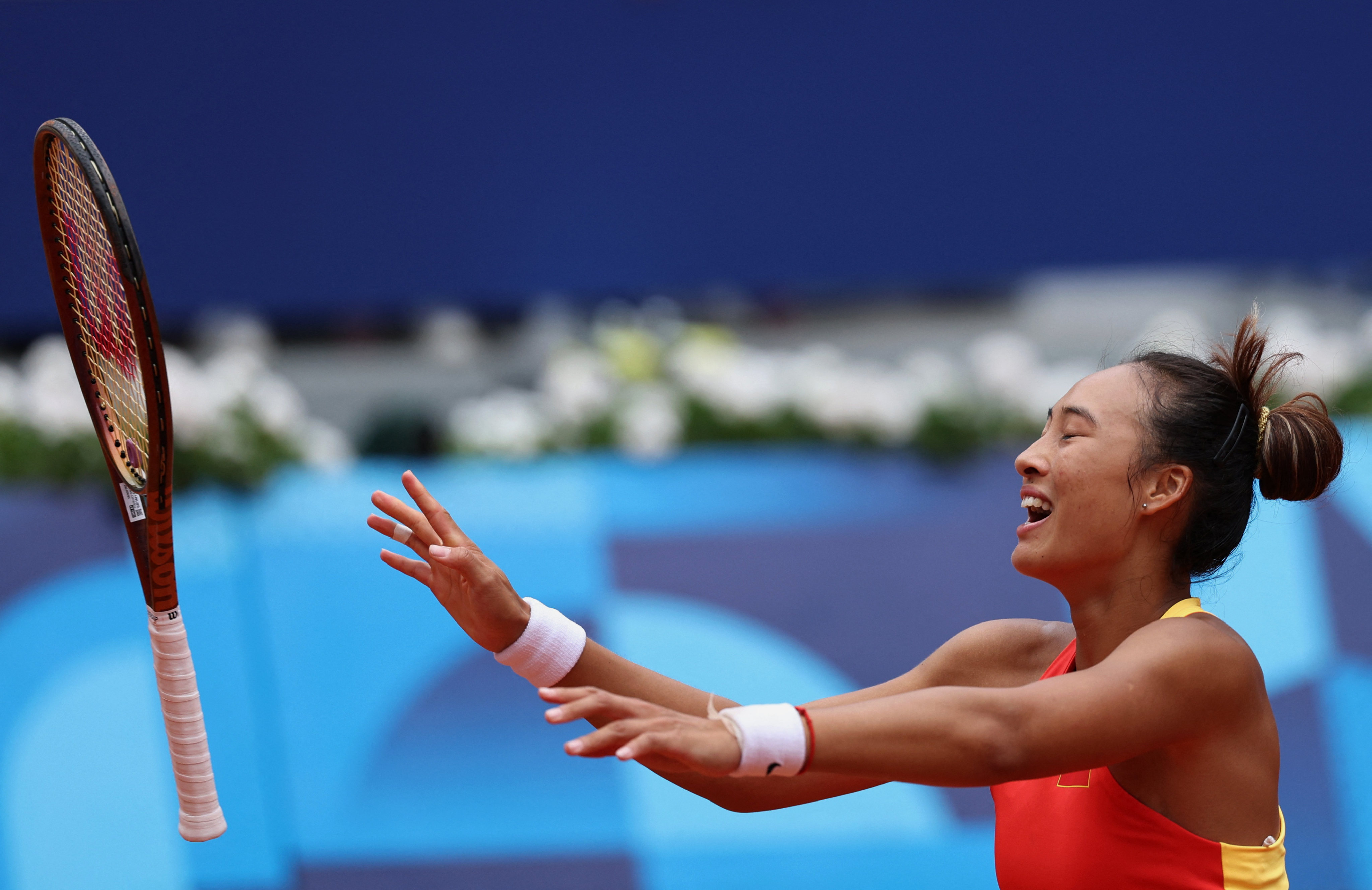 Zheng Qinwen celebrates clinching gold by beating Donna Vekic of Croatia. Photo: Reuters