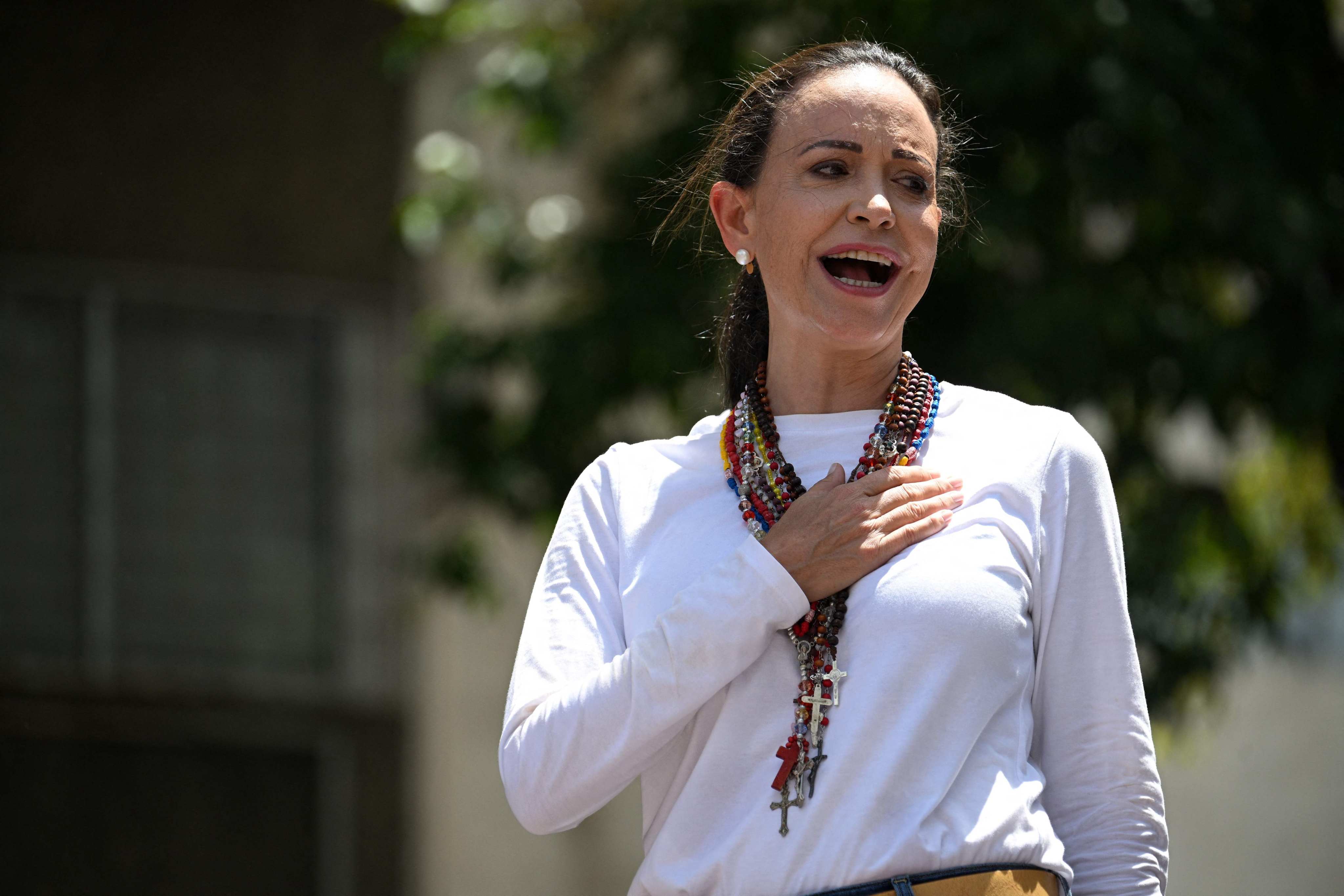 Venezuelan opposition leader Maria Corina Machado sings the national anthem during a demonstration in Caracas on Saturday. Photo: AFP