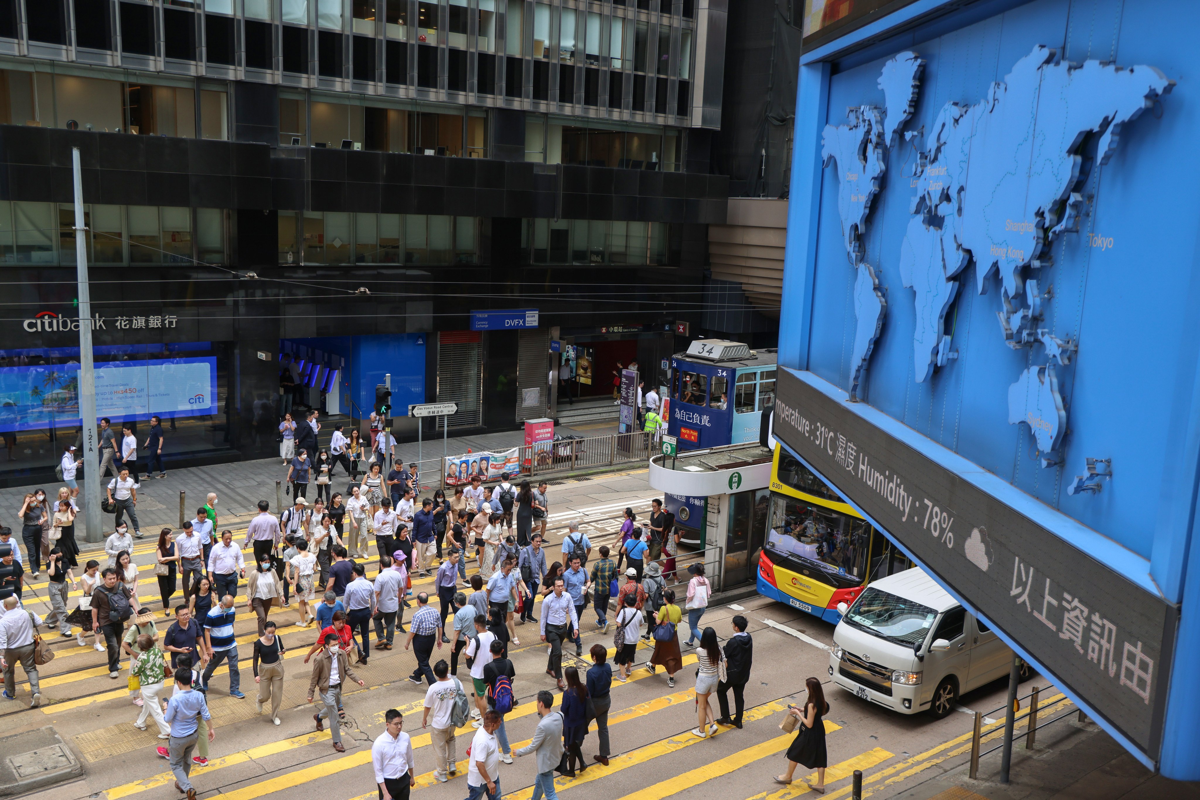 People cross a road in Central, Hong Kong, during lunch time on June 18, 2024. Photo: Jelly Tse