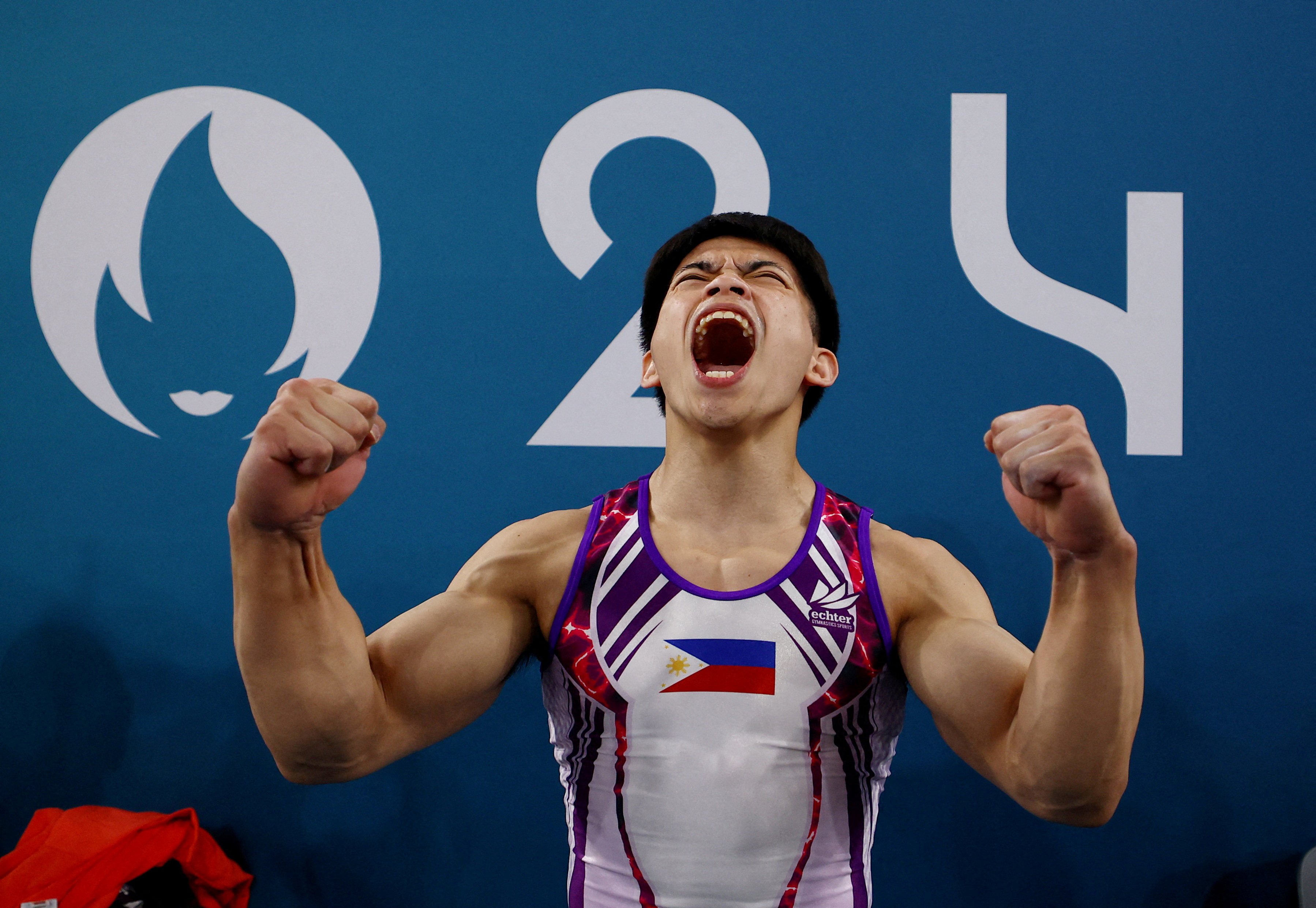 Carlos Yulo celebrates after winning gold in men’s gymnastics. Photo: Reuters