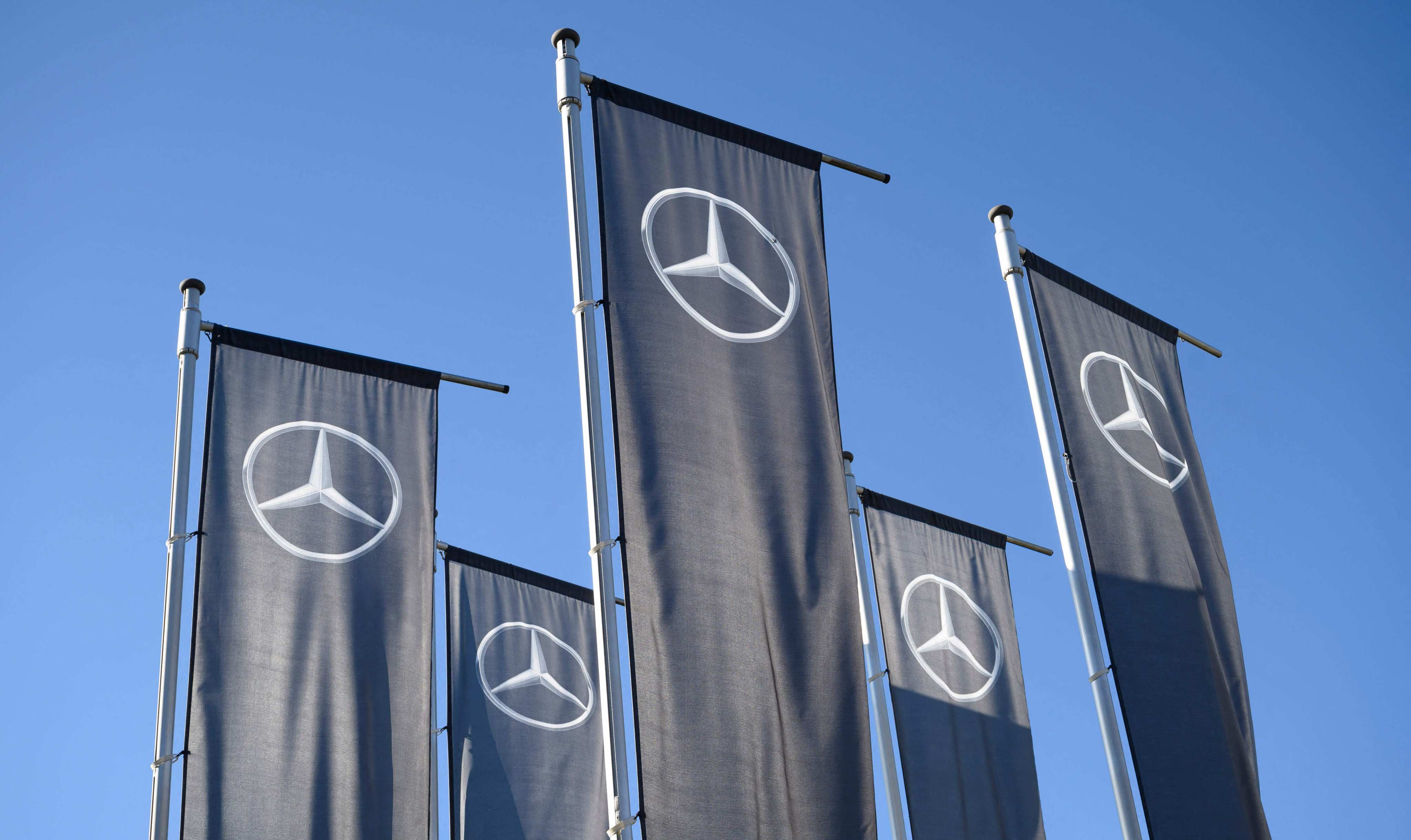 Flags with the Mercedes logo are seen in front of the company’s customer centre in Sindelfingen, Germany, February 13, 2023. Photo: AFP