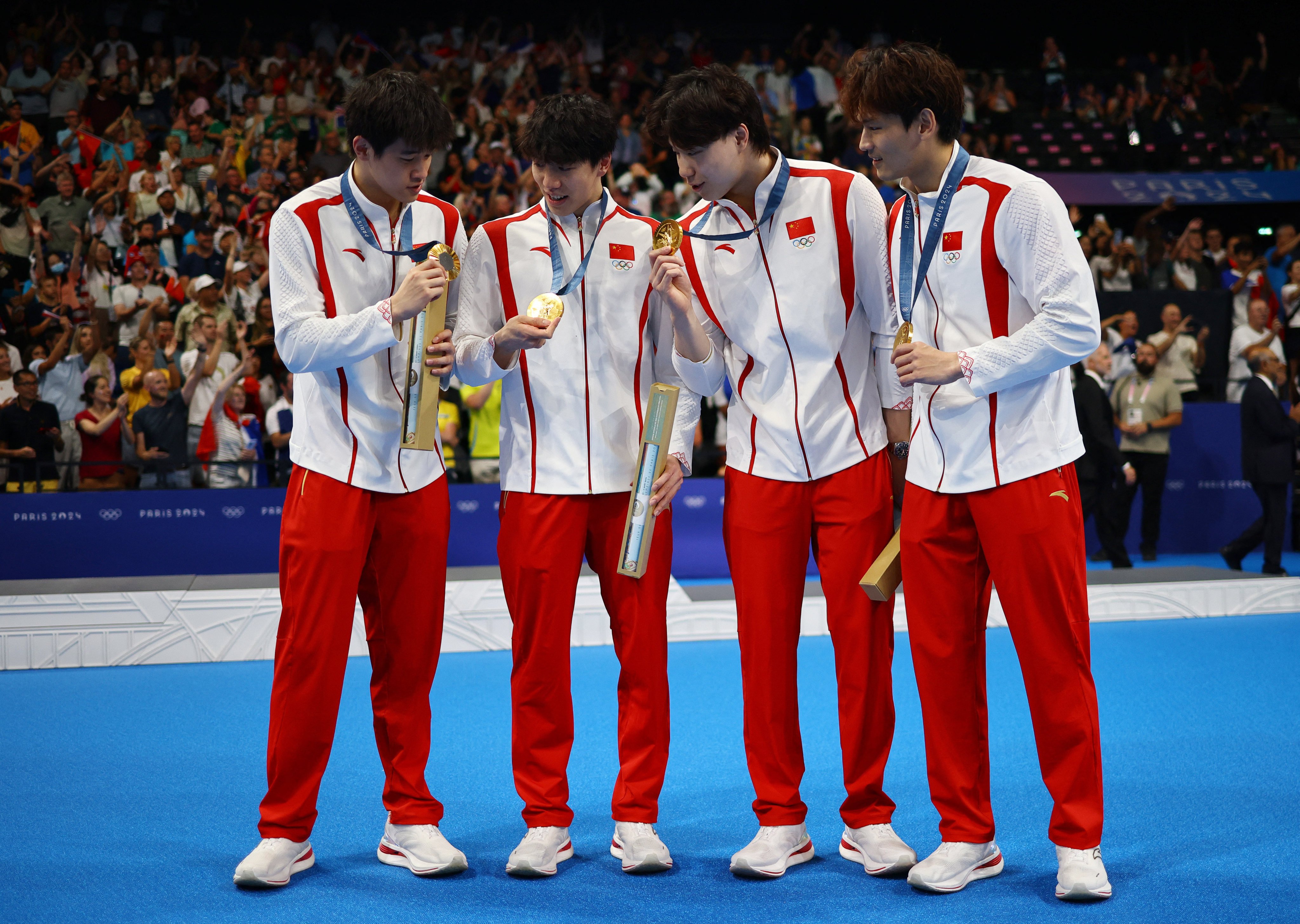 Pan Zhanle (left), with fellow gold medallists (from left) Sun Jiajun, Qin Haiyang and Xu Jiayu. Photo: Reuters